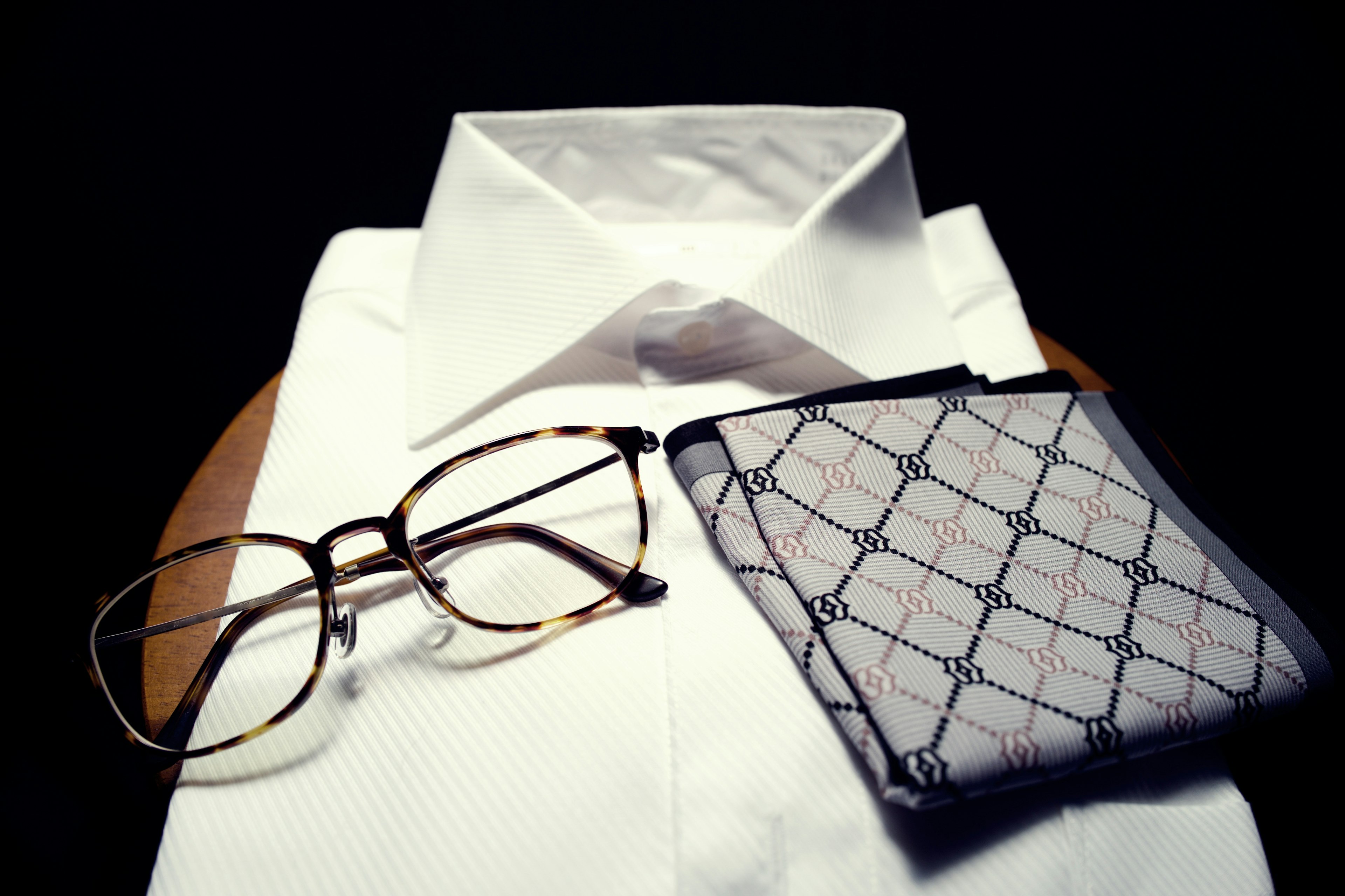 White shirt with glasses and patterned handkerchief