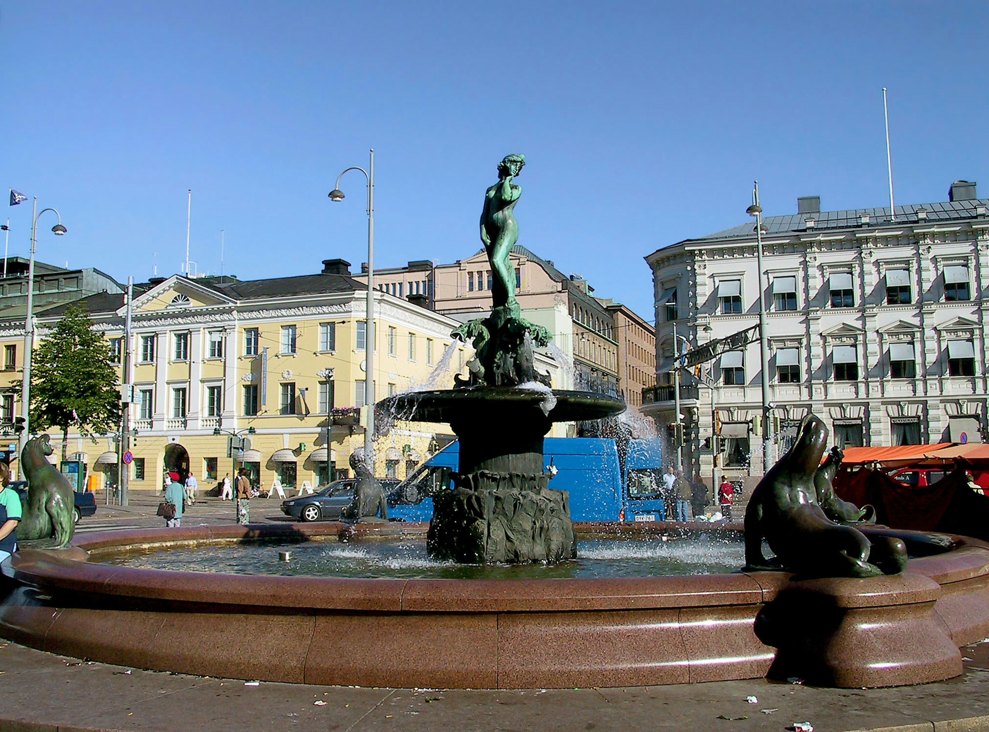 Beautiful fountain and sculptures in a square in Helsinki