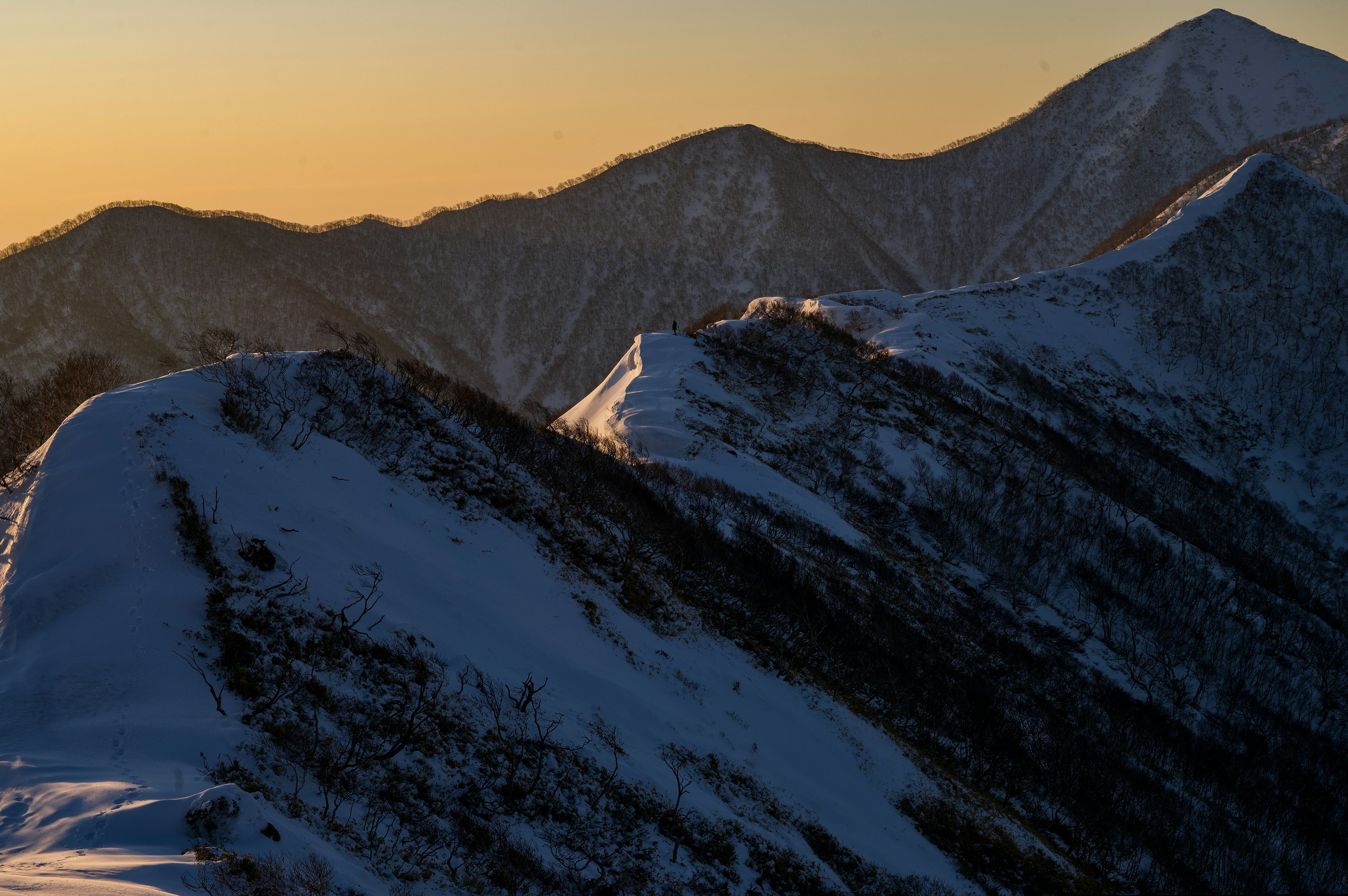 Snow-covered mountains with a beautiful sunset