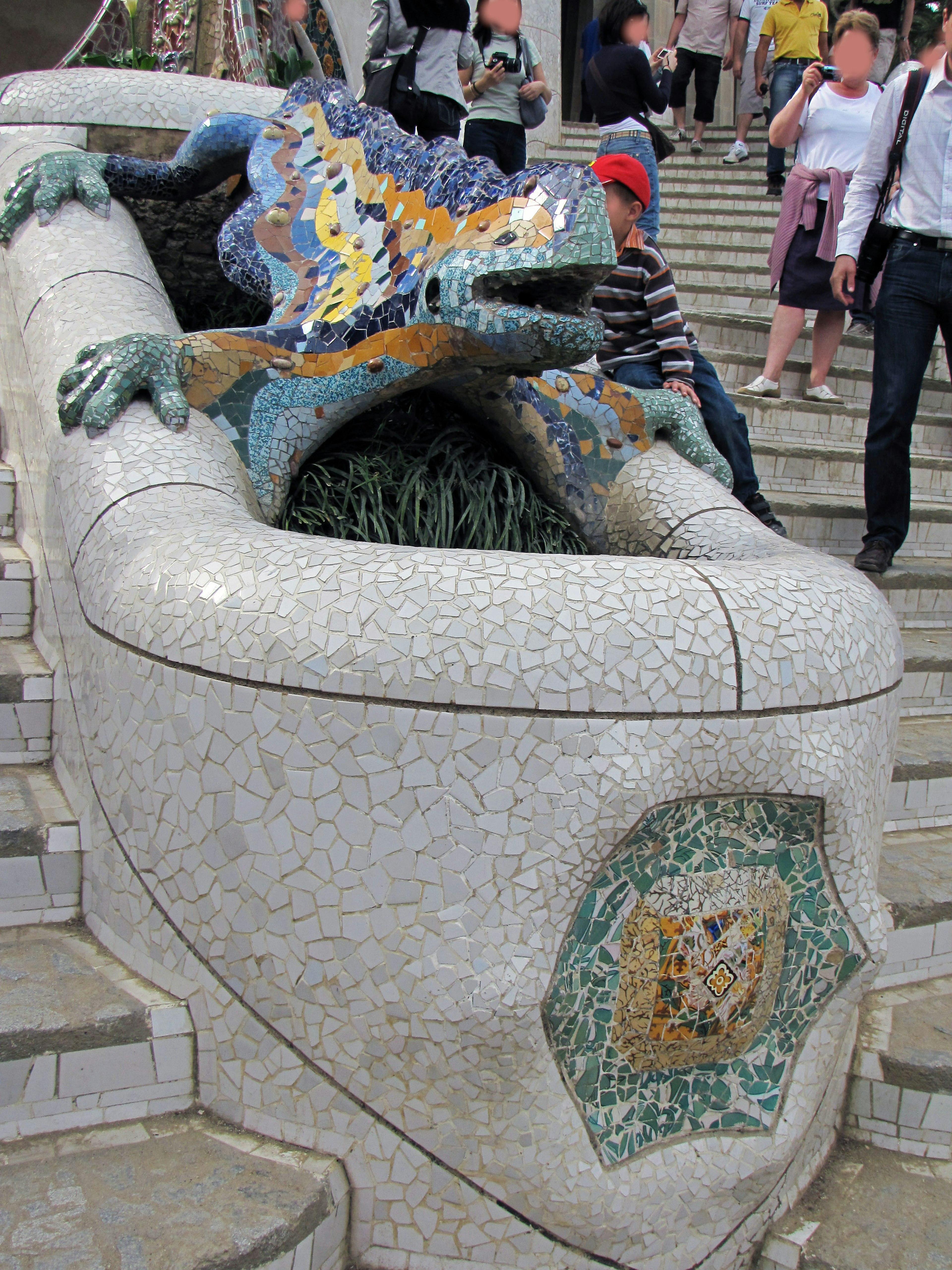 Colorful mosaic lizard sculpture on a staircase