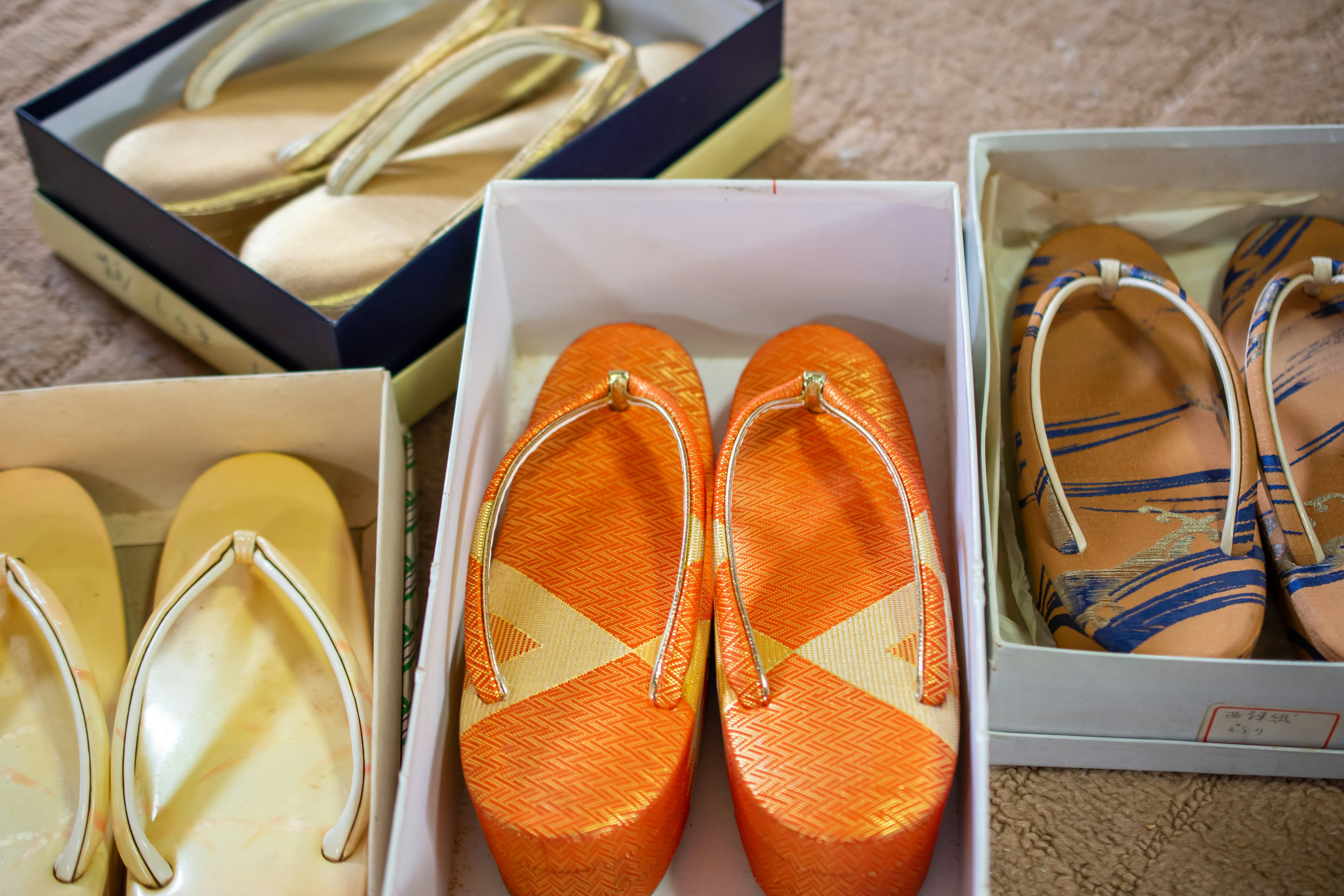 Image of various colored flip-flops in boxes