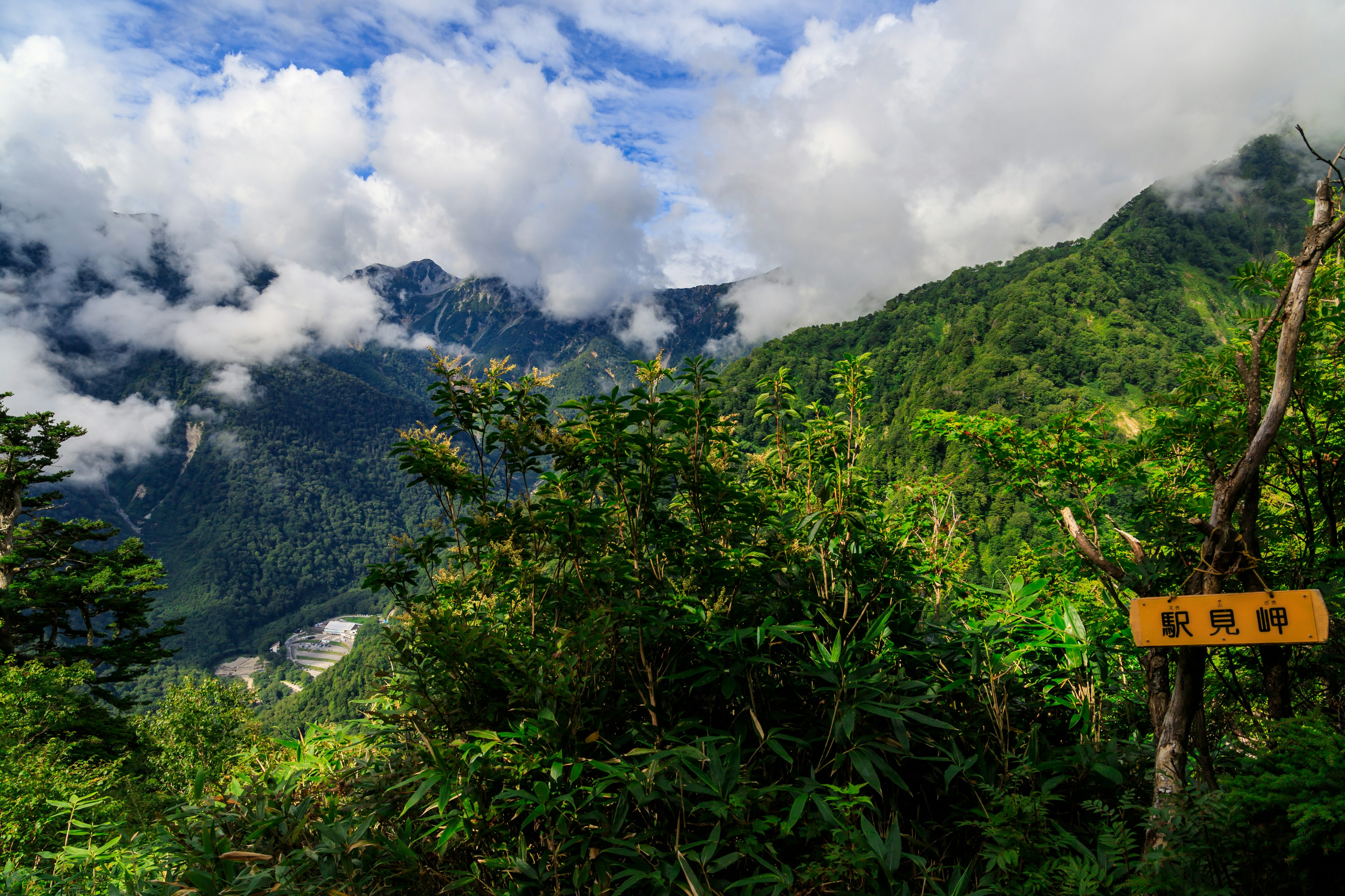 Lush green mountains with a cloudy sky