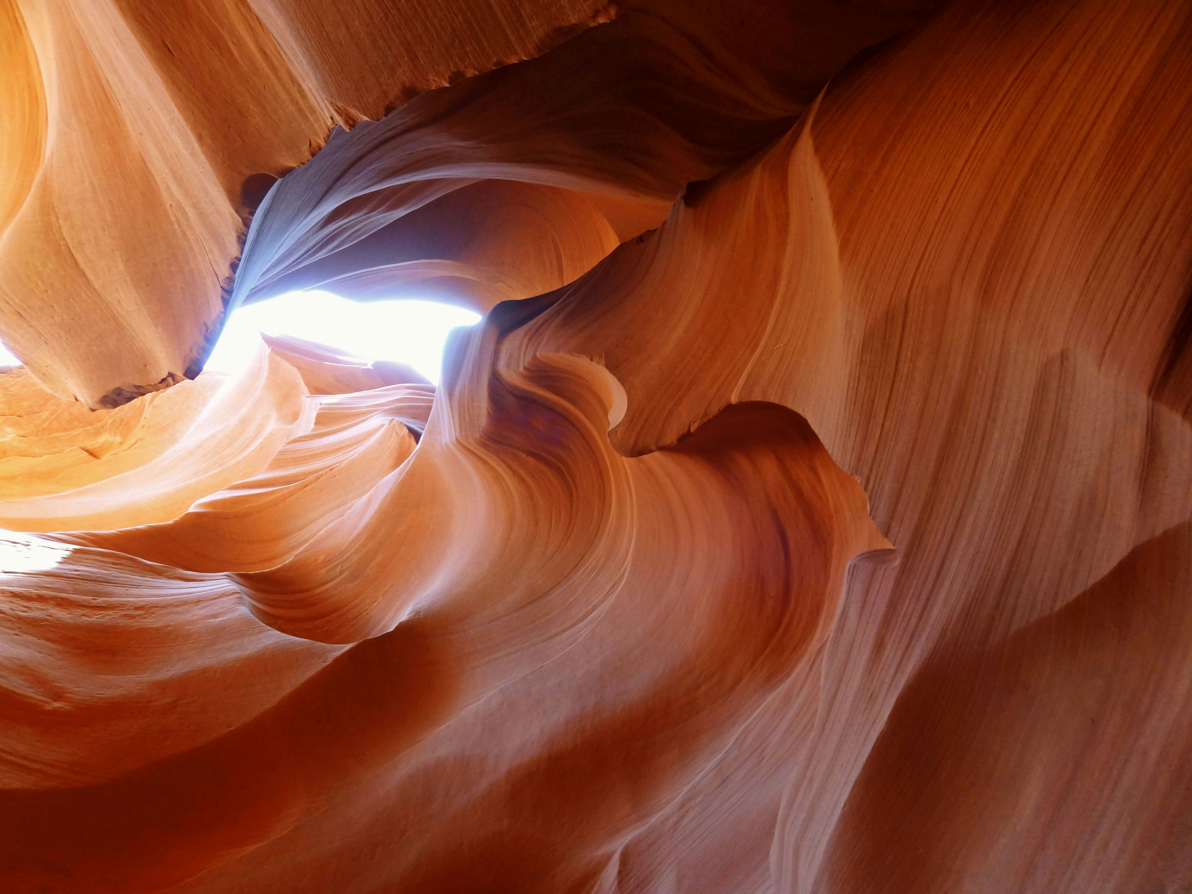 Smooth orange rock walls of Antelope Canyon with light effects