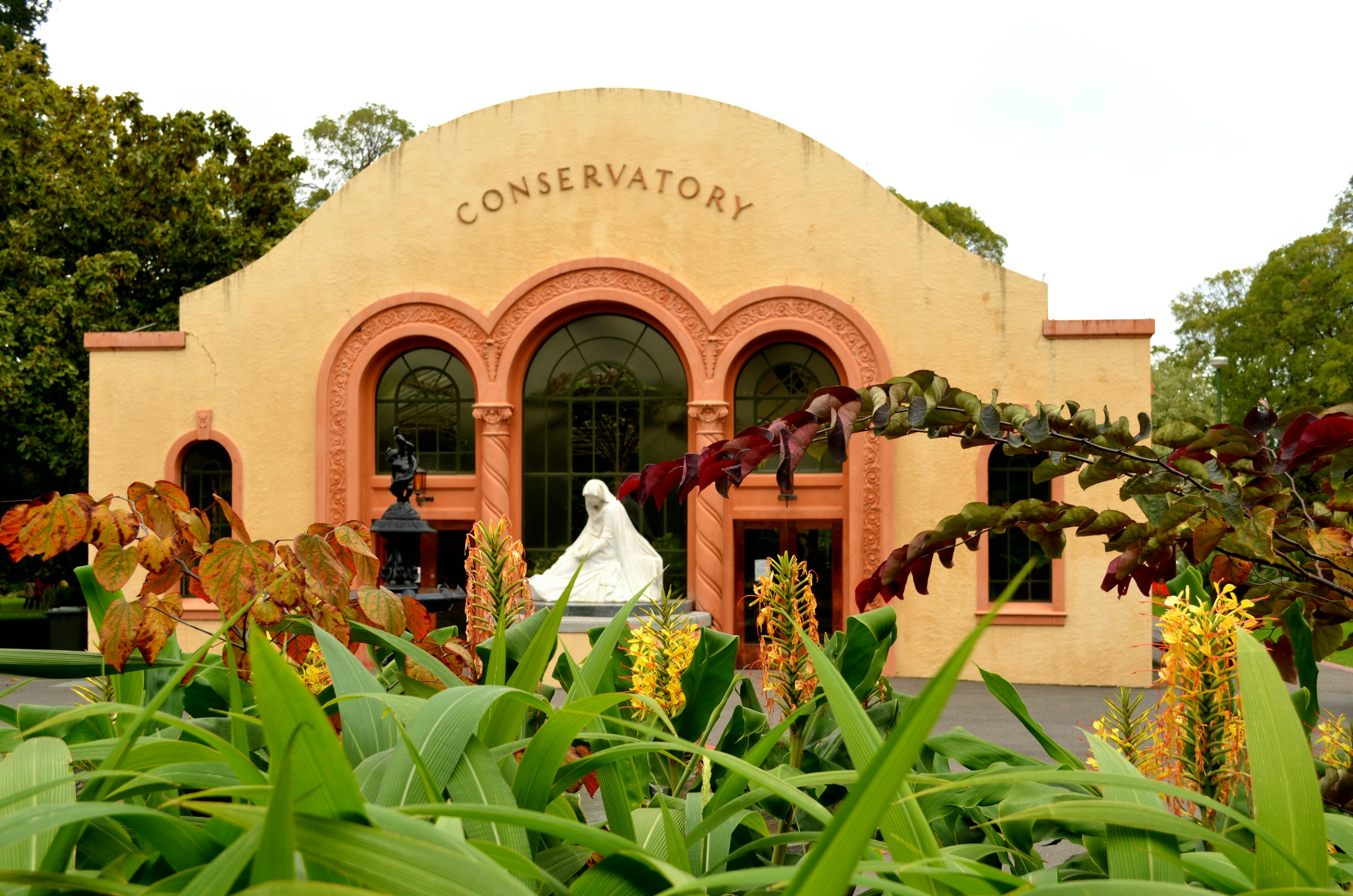 Exterior of a conservatory with vibrant greenery