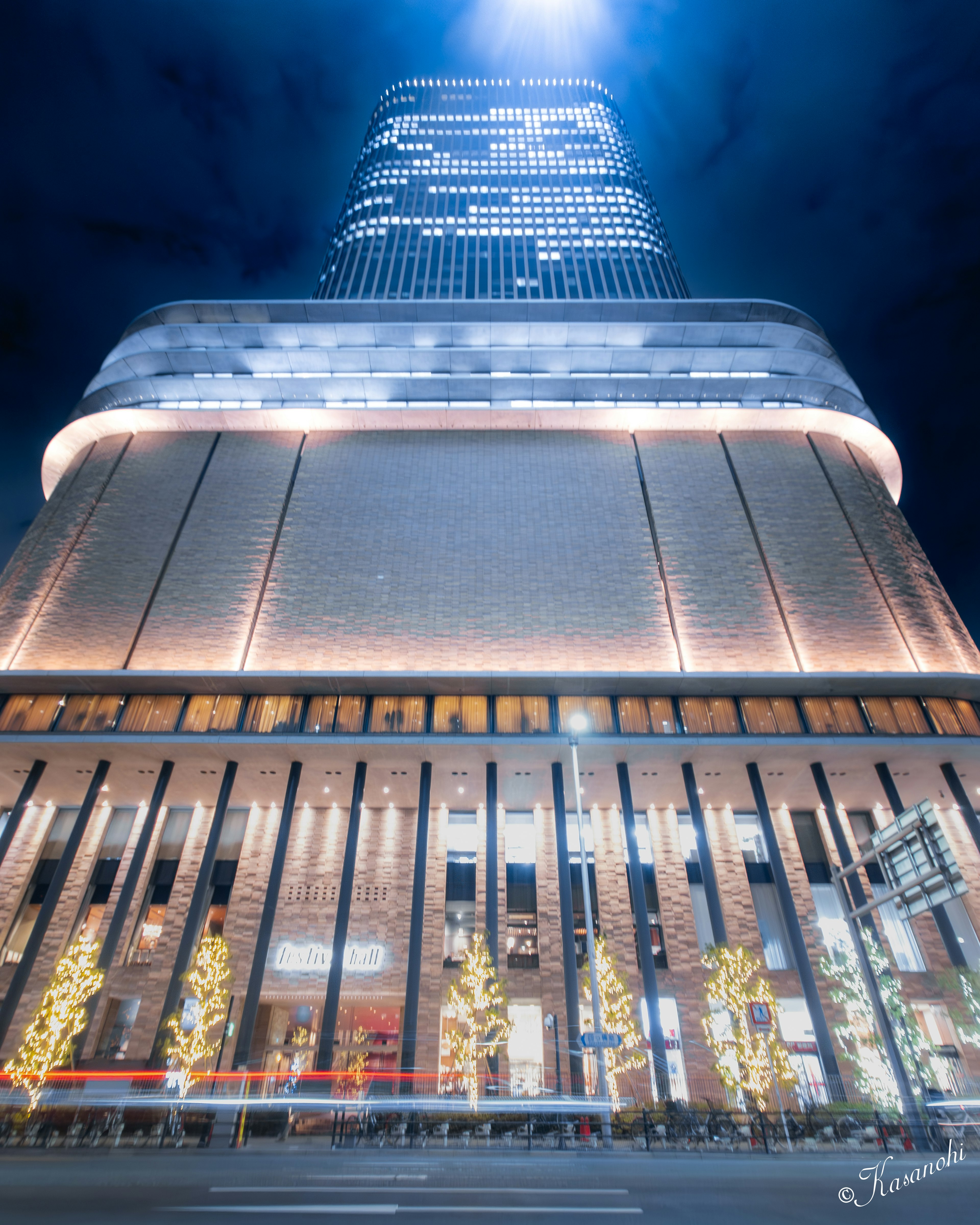 Night view of a skyscraper taken from below with illuminated features