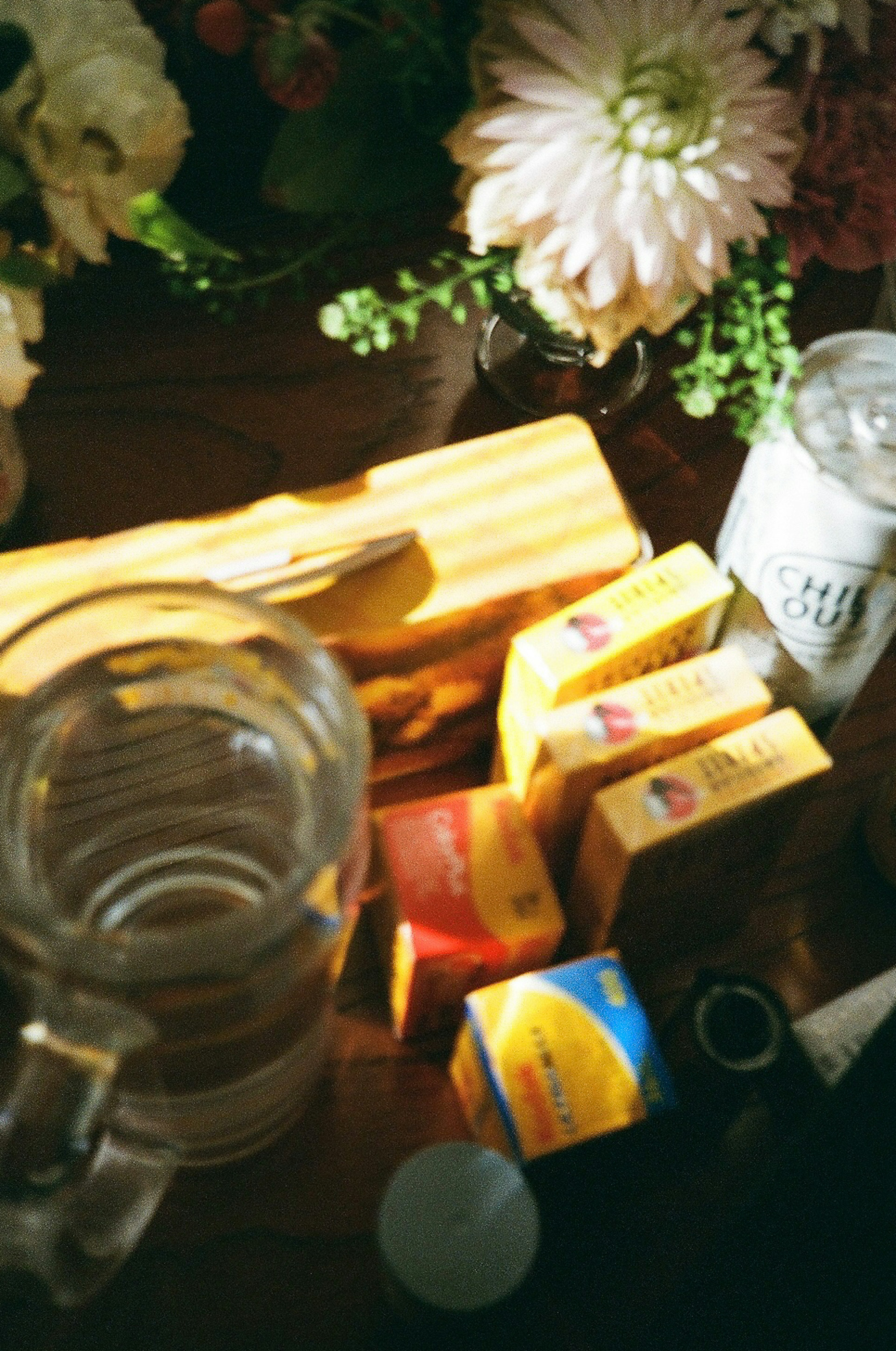 A pitcher of water and tea bag boxes arranged on a table