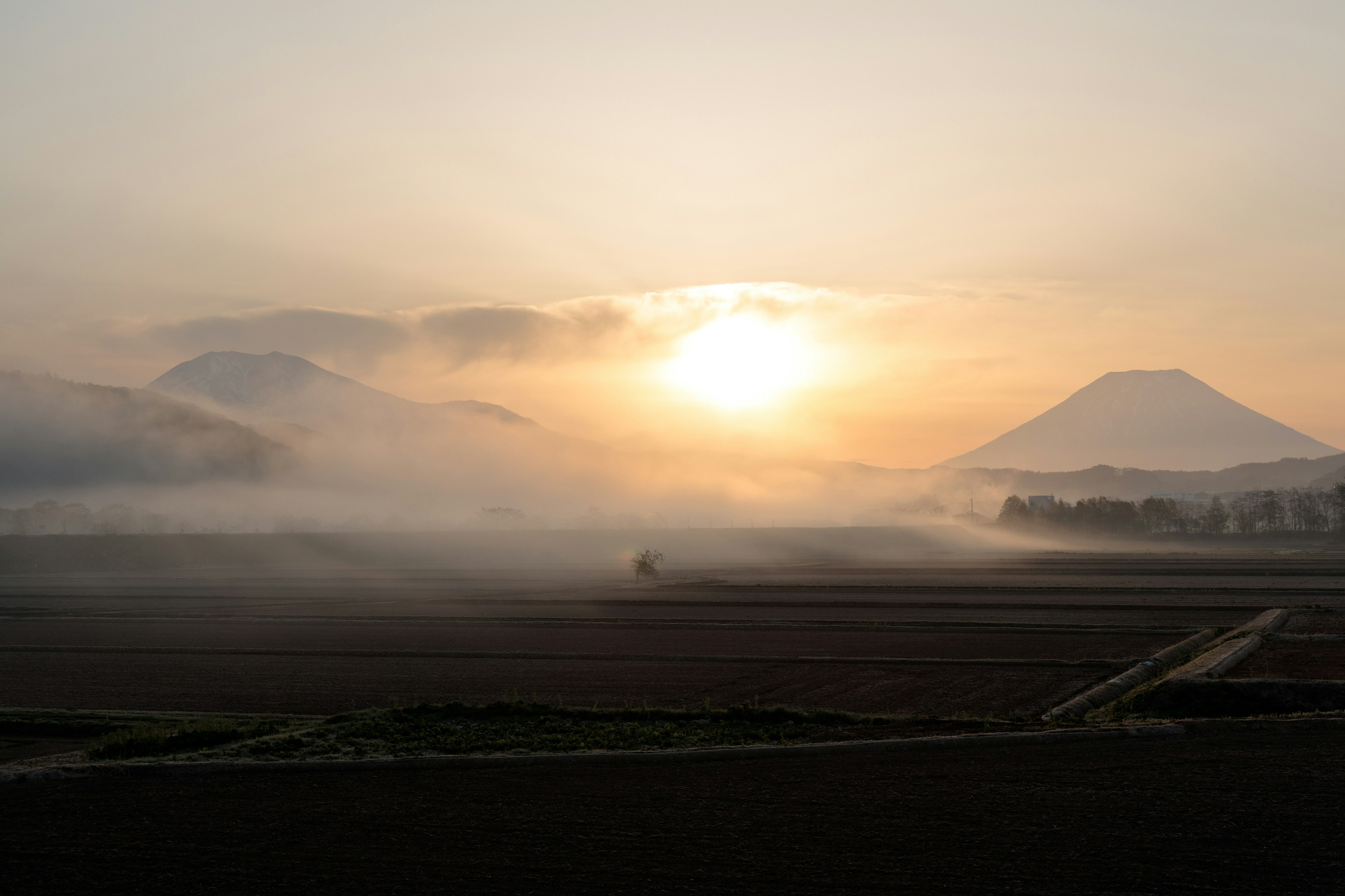 Foggy mountains with a beautiful sunset