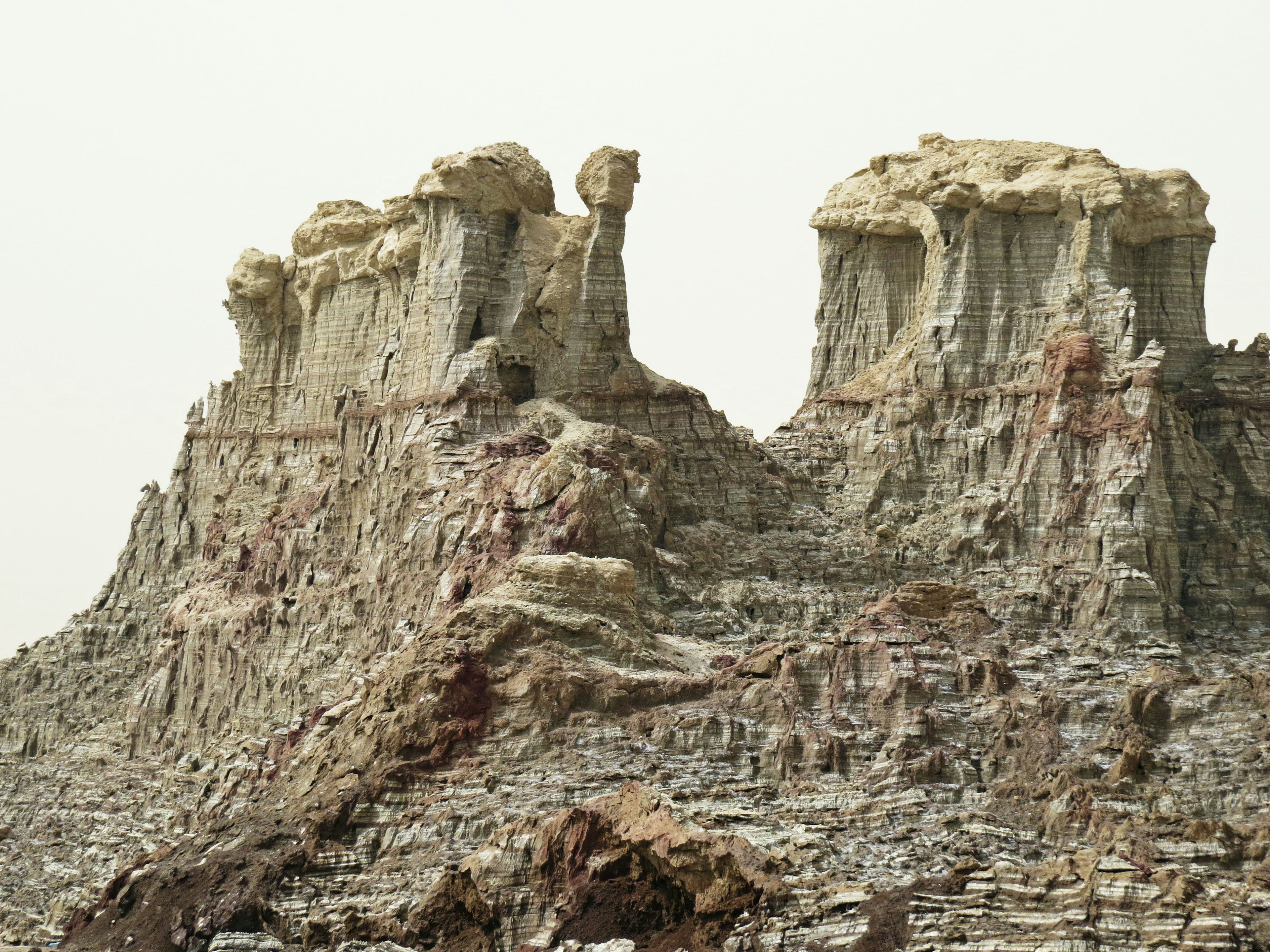 Weathered mountain with distinctive rock formations and layered structures