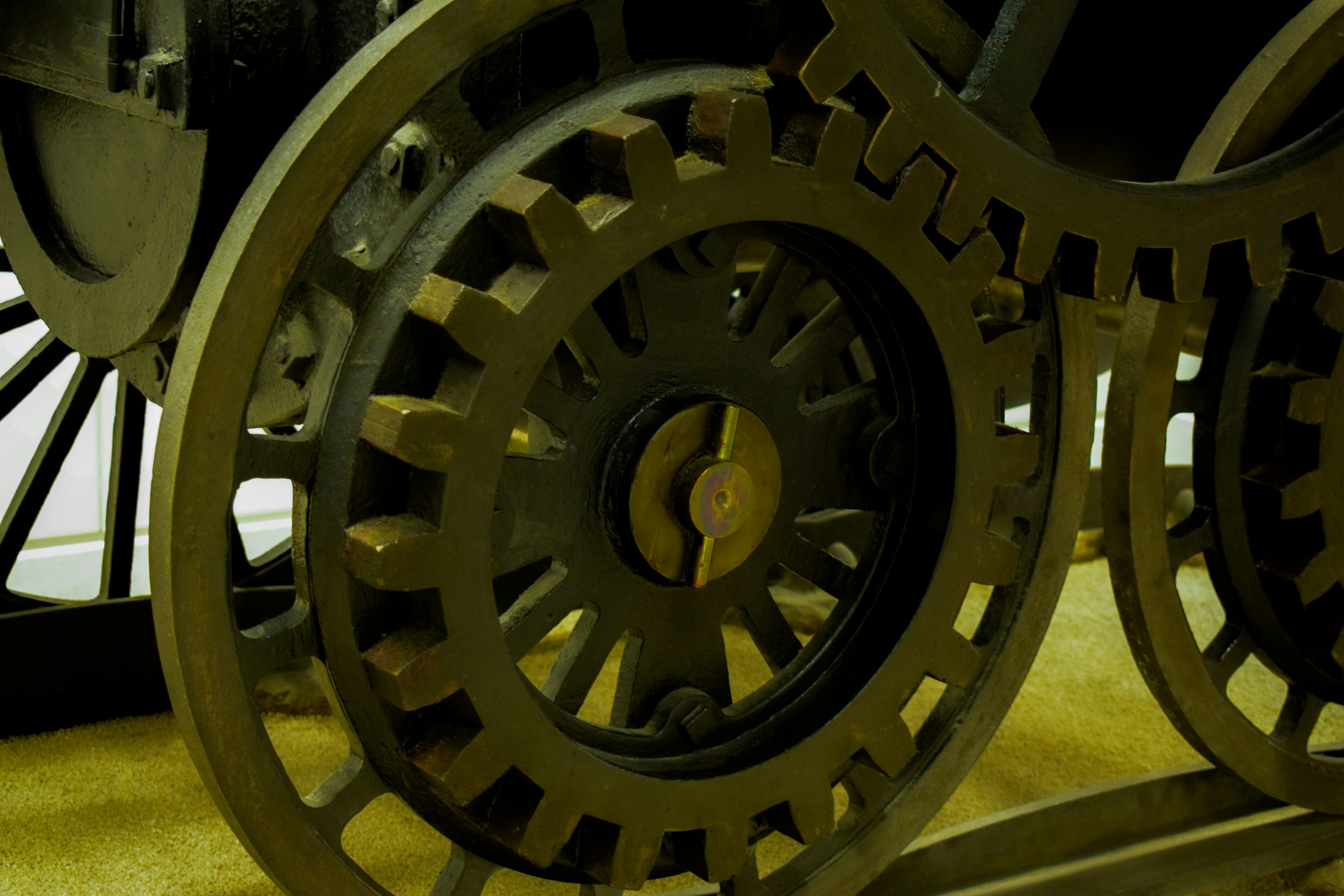 Close-up of mechanical gears featuring interlocking iron cogs