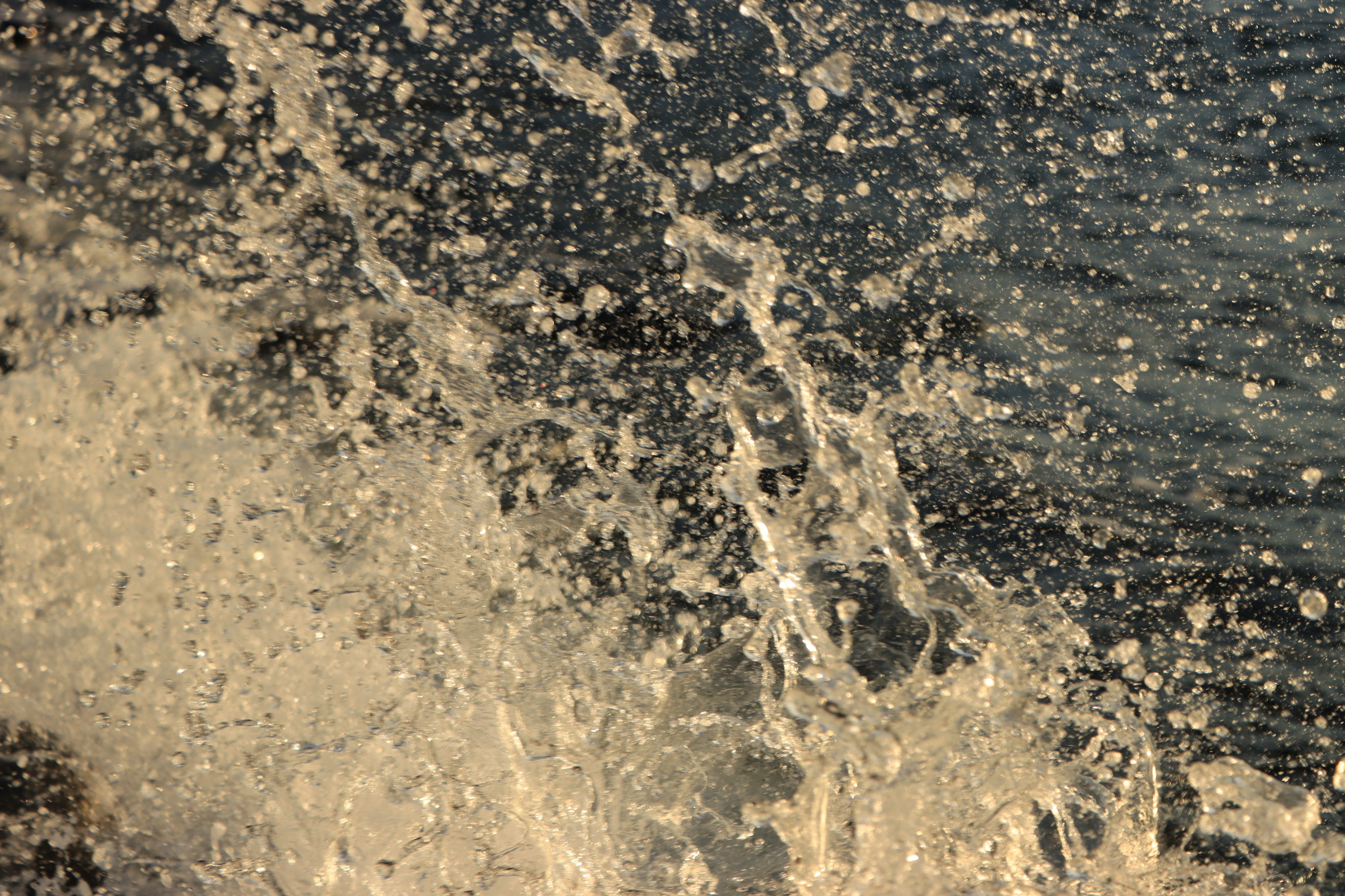 Close-up of ocean waves crashing against rocks