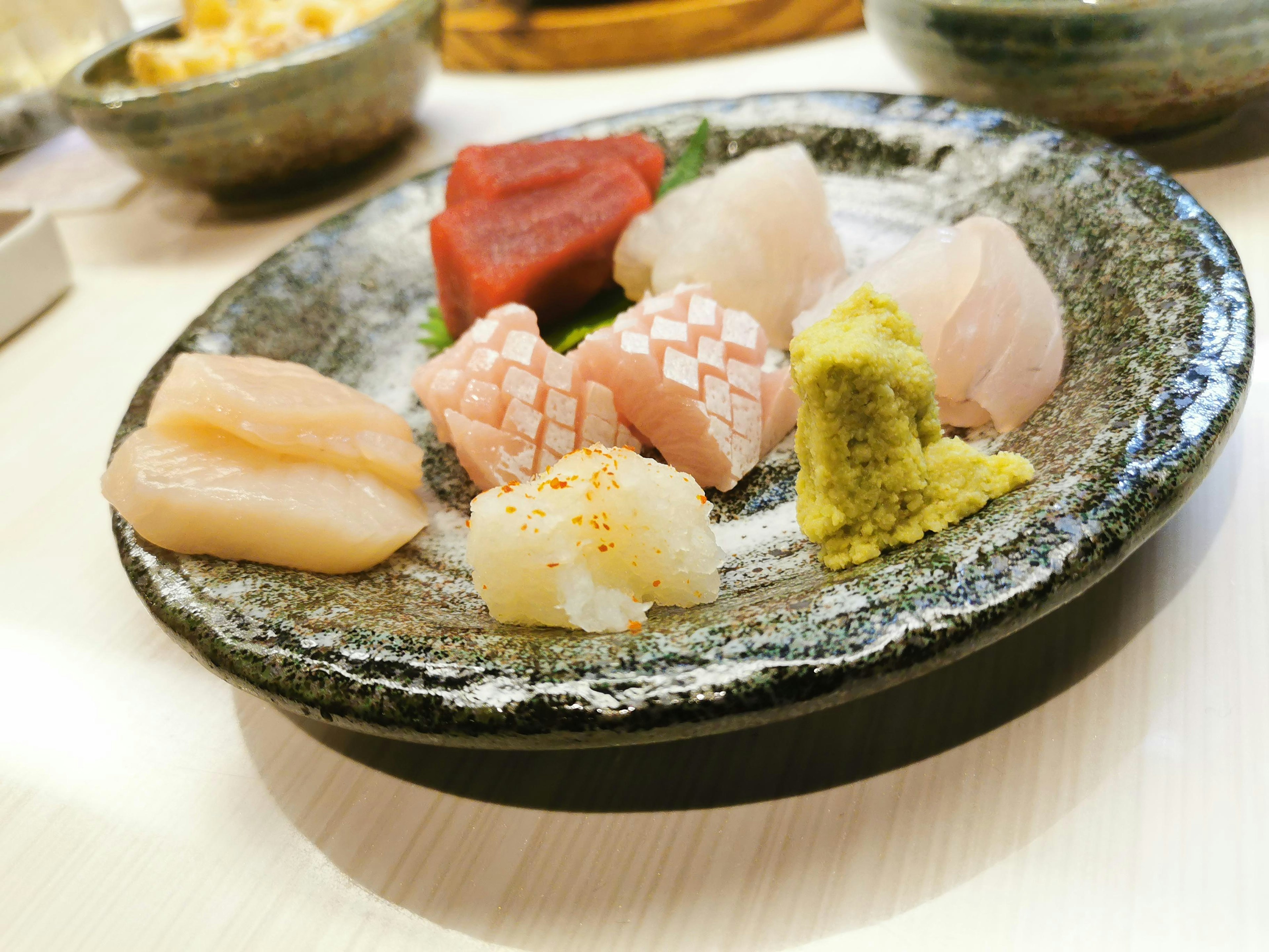 A beautiful assortment of sushi presented on a black plate