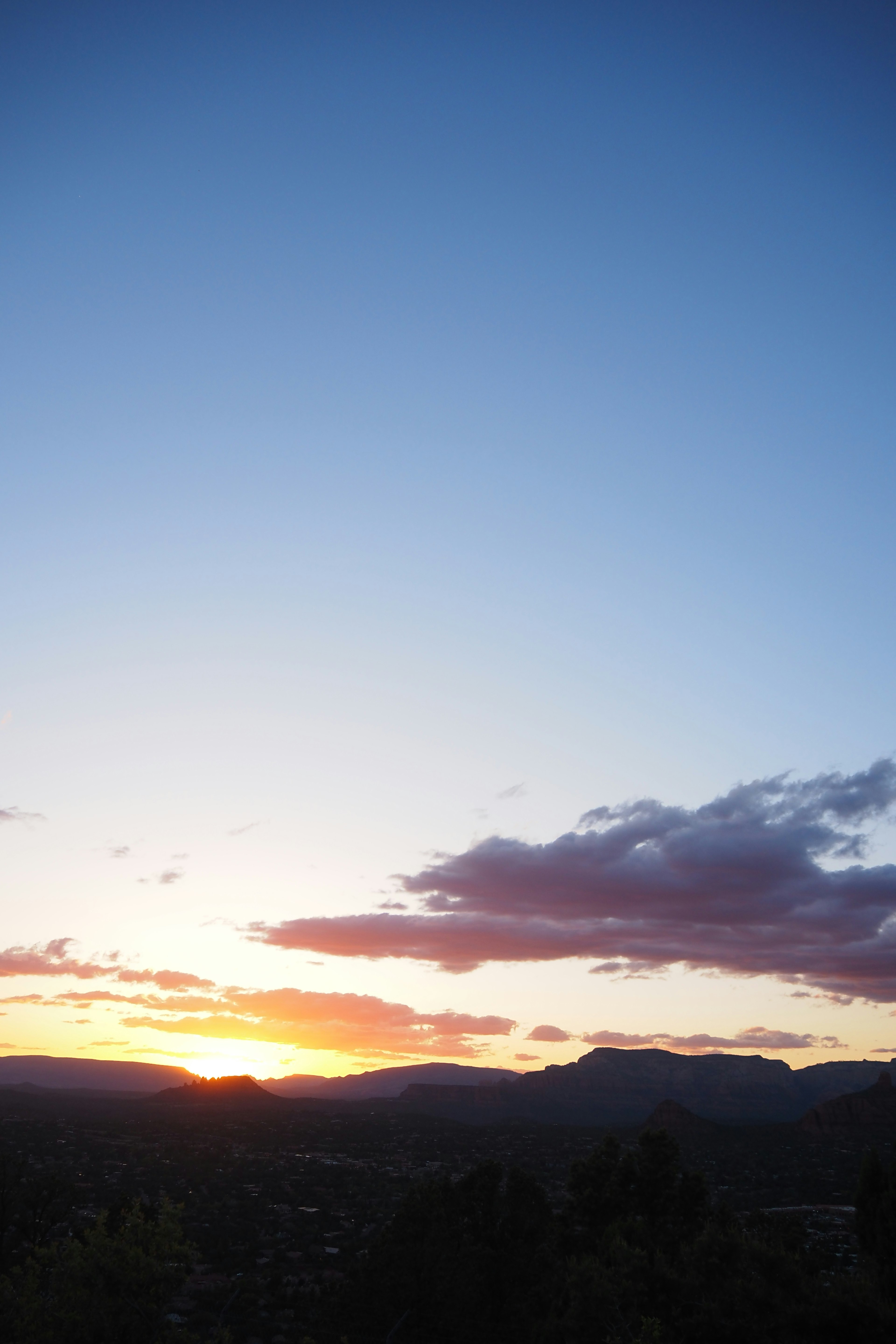 Beautiful landscape with sunset sky and mountain silhouettes