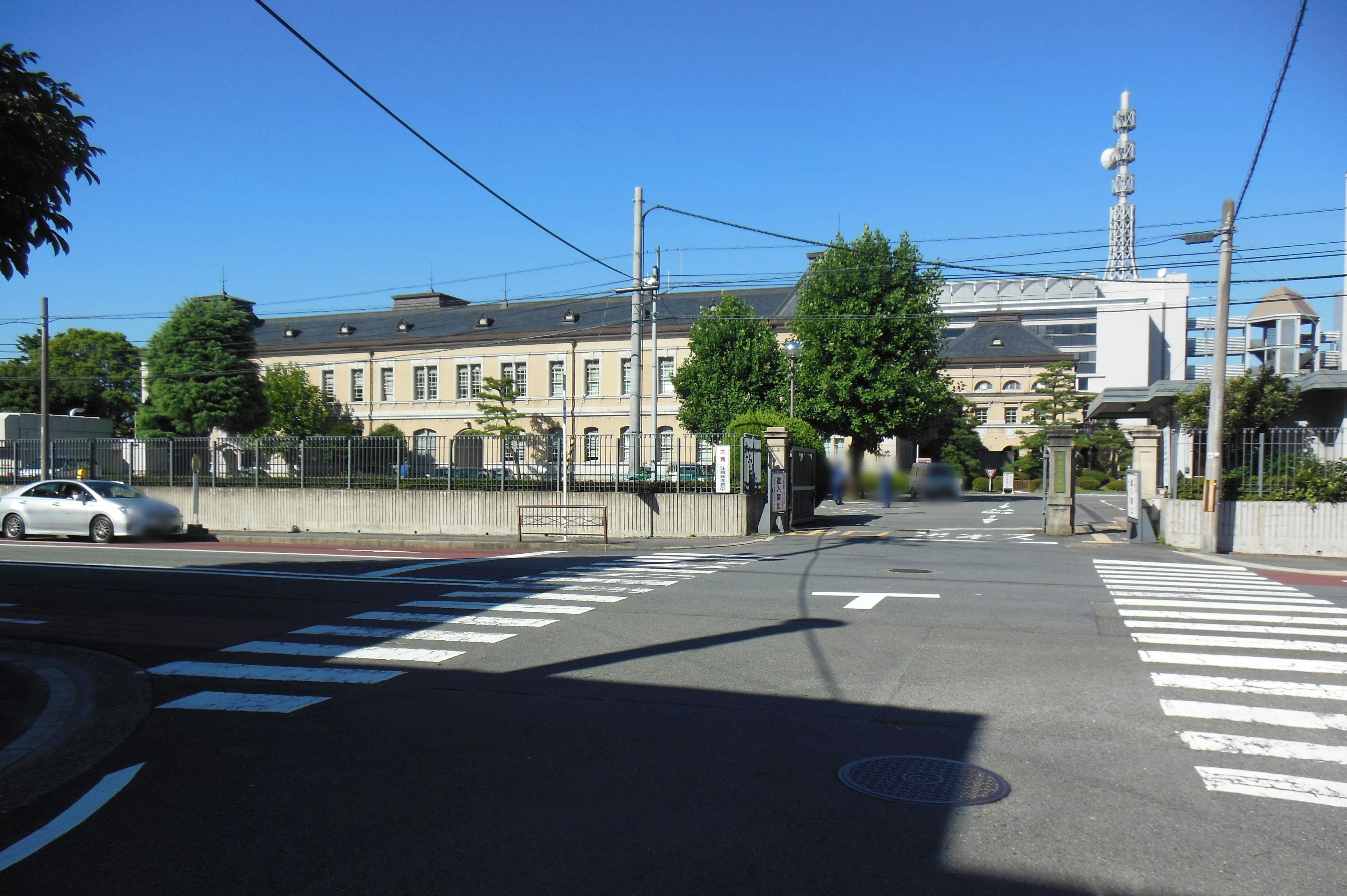 Historic building and crosswalk under a clear blue sky