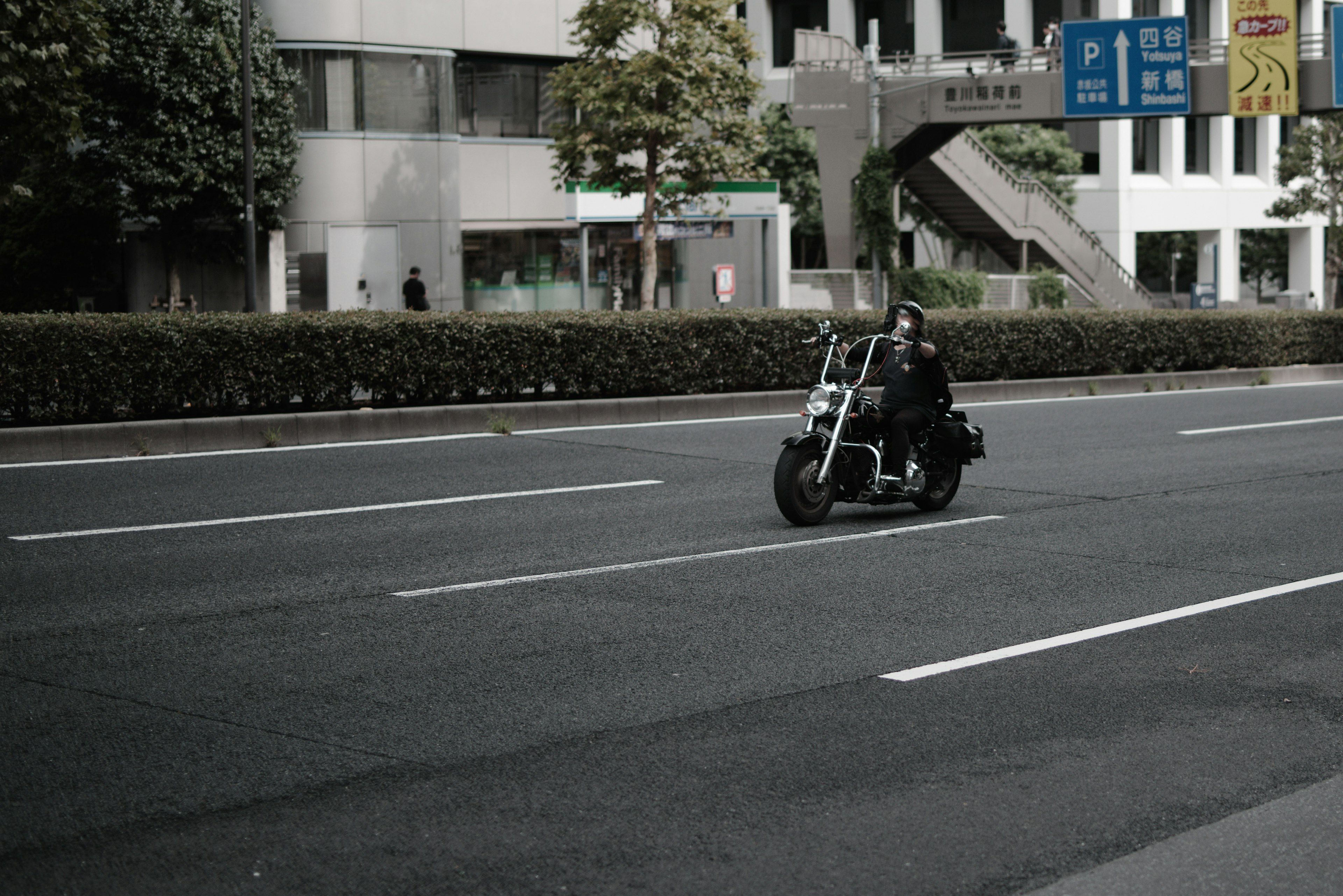 A motorcycle riding on an urban road