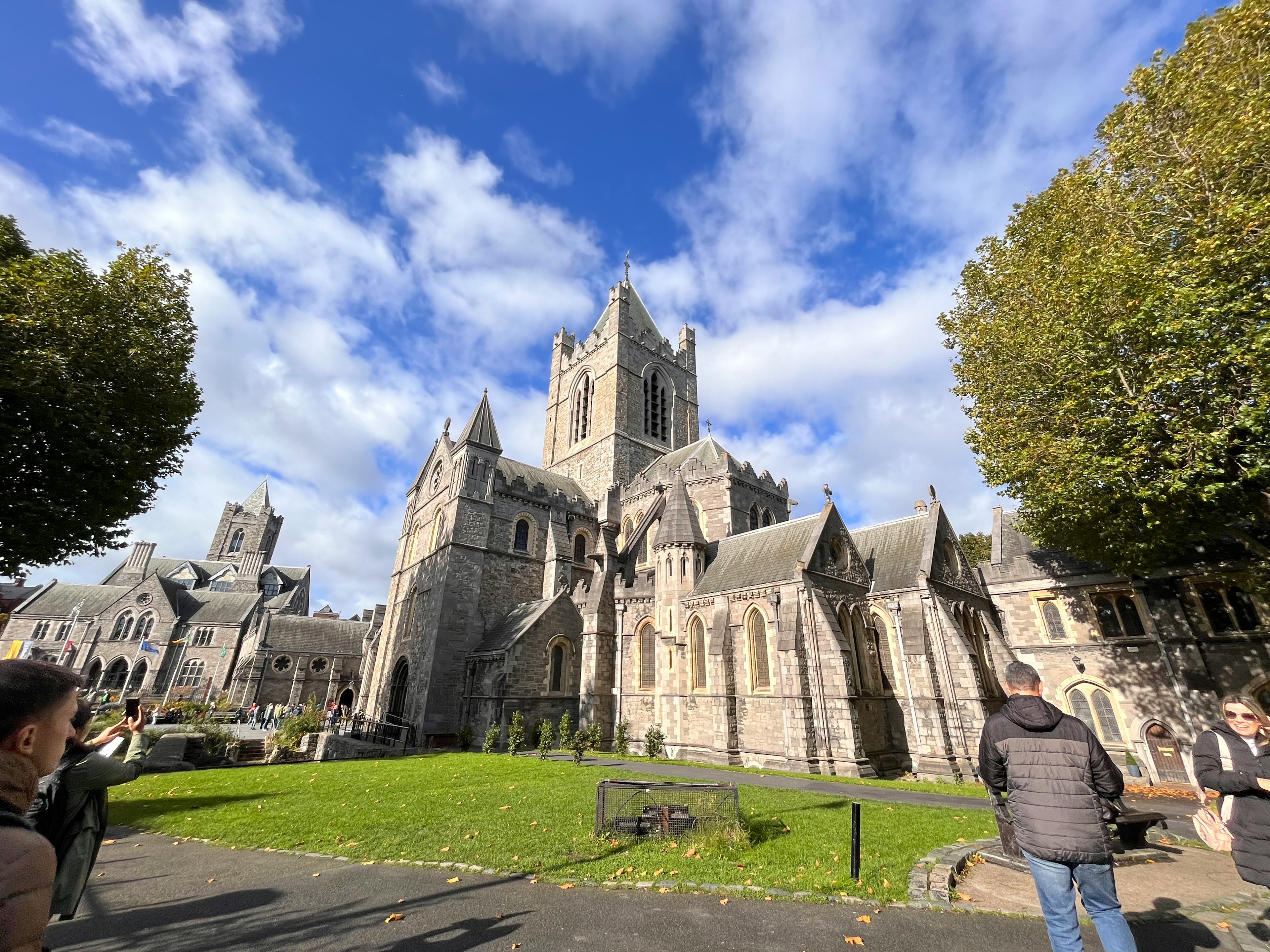 Stunning cathedral exterior with green lawn under blue sky