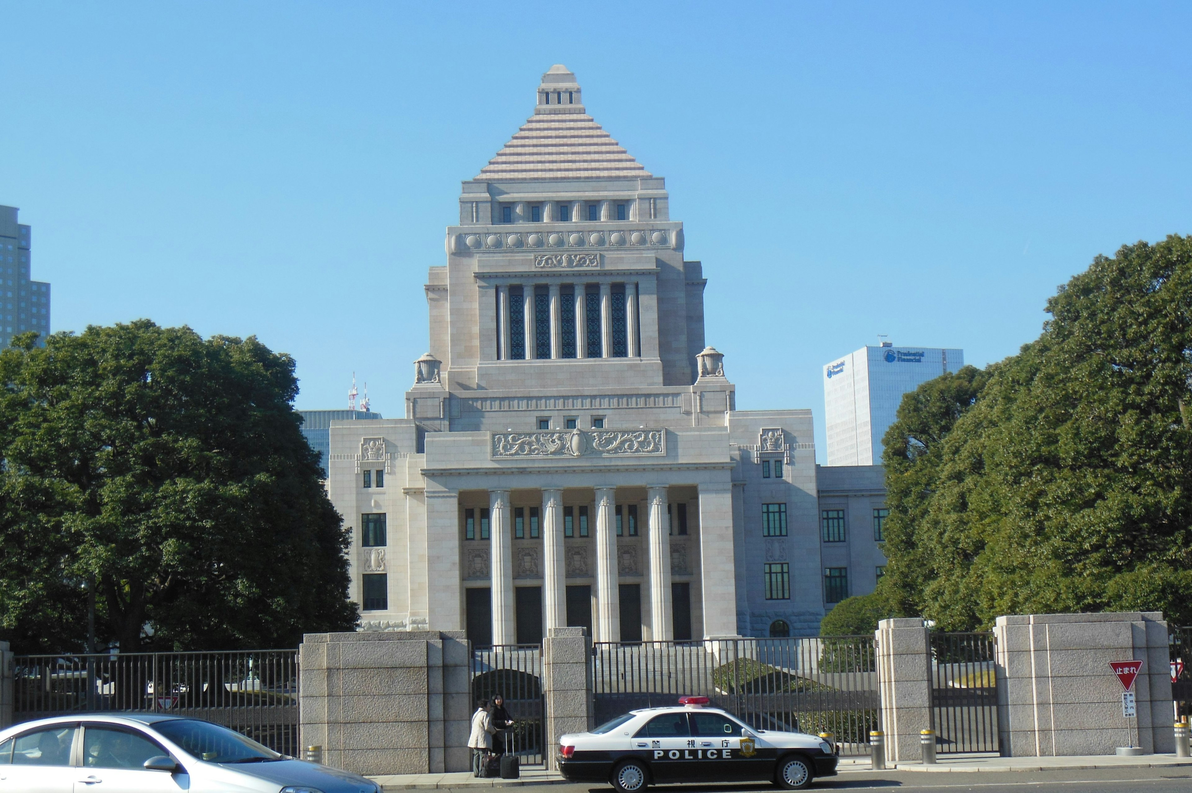 Majestic architecture of the National Diet Building with surrounding greenery