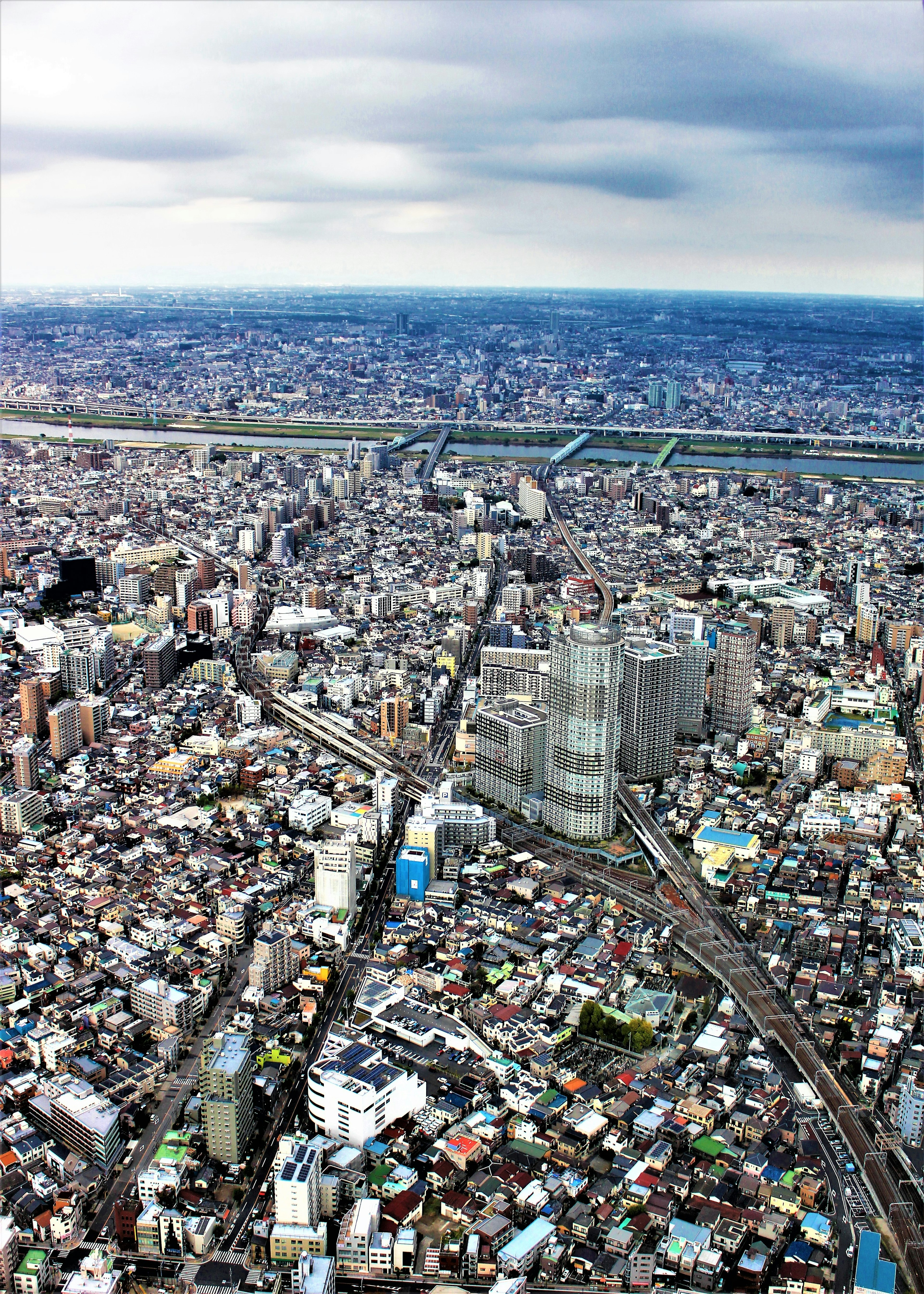 Aerial view of a city featuring a mix of buildings and roads