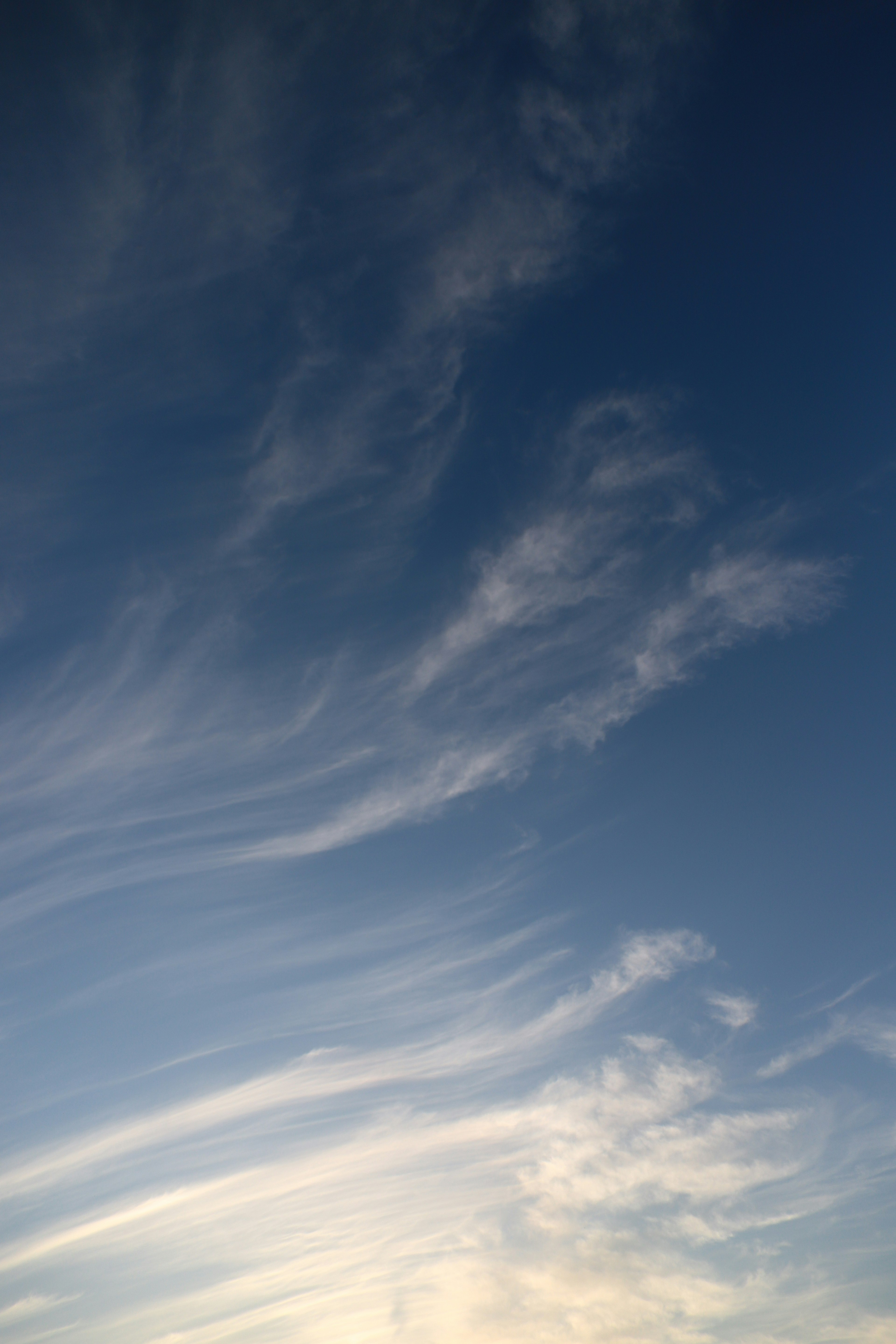 Beautiful patterns of wispy clouds in a blue sky