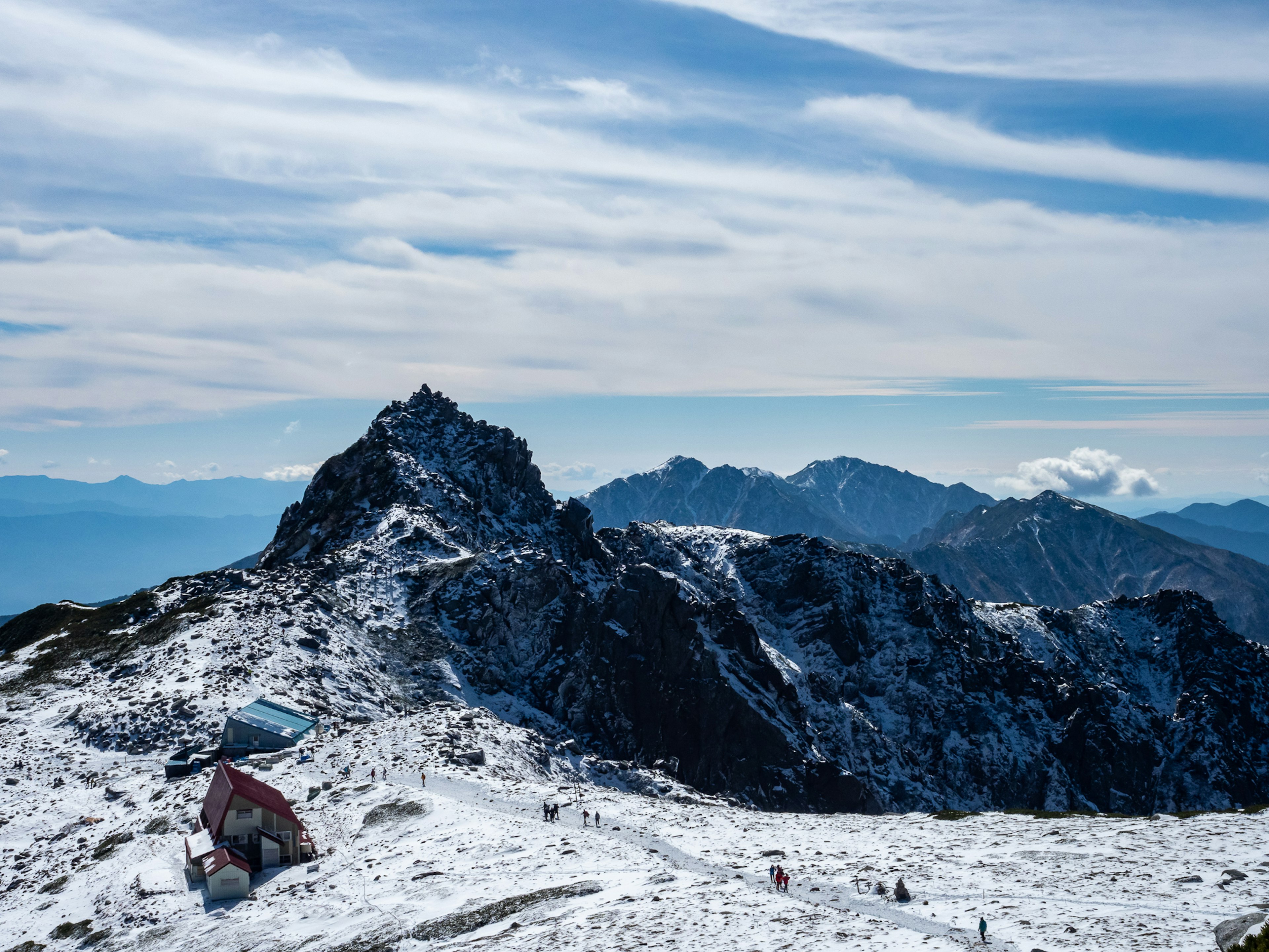 Snow-covered mountain landscape with a beautiful blue sky