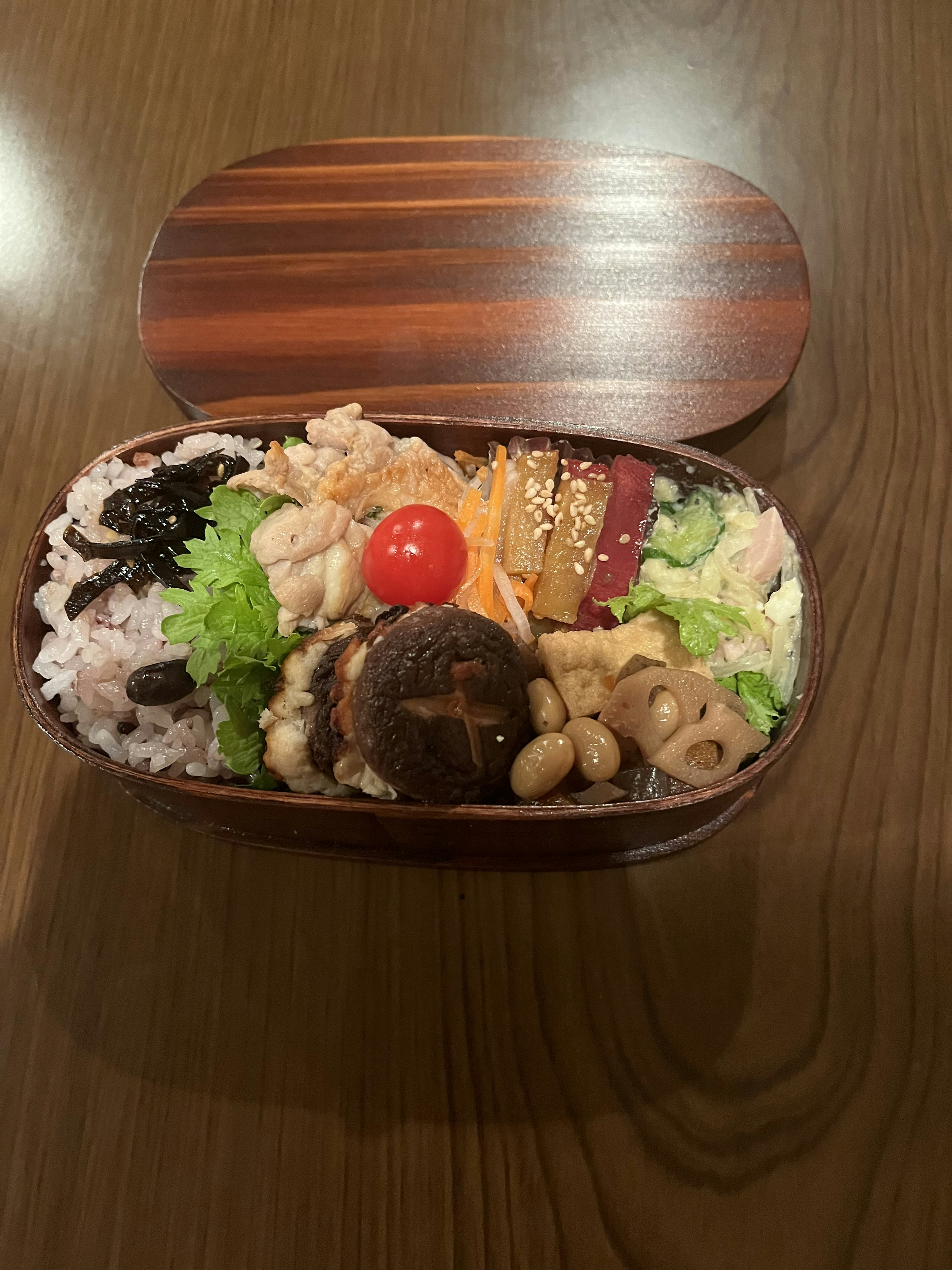 Colorful bento box filled with rice and various ingredients