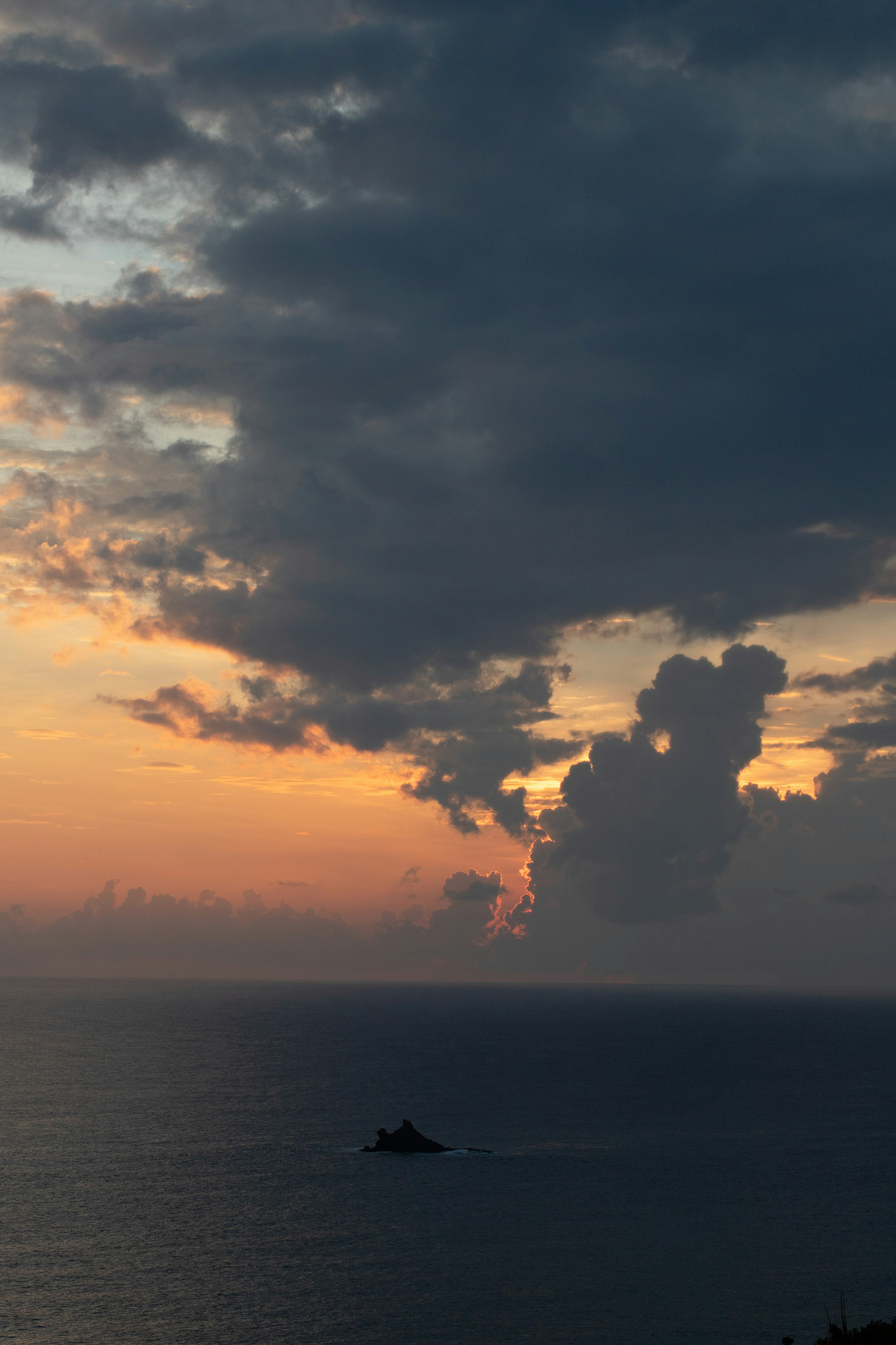 Stunning sunset over the ocean with dramatic cloud formations