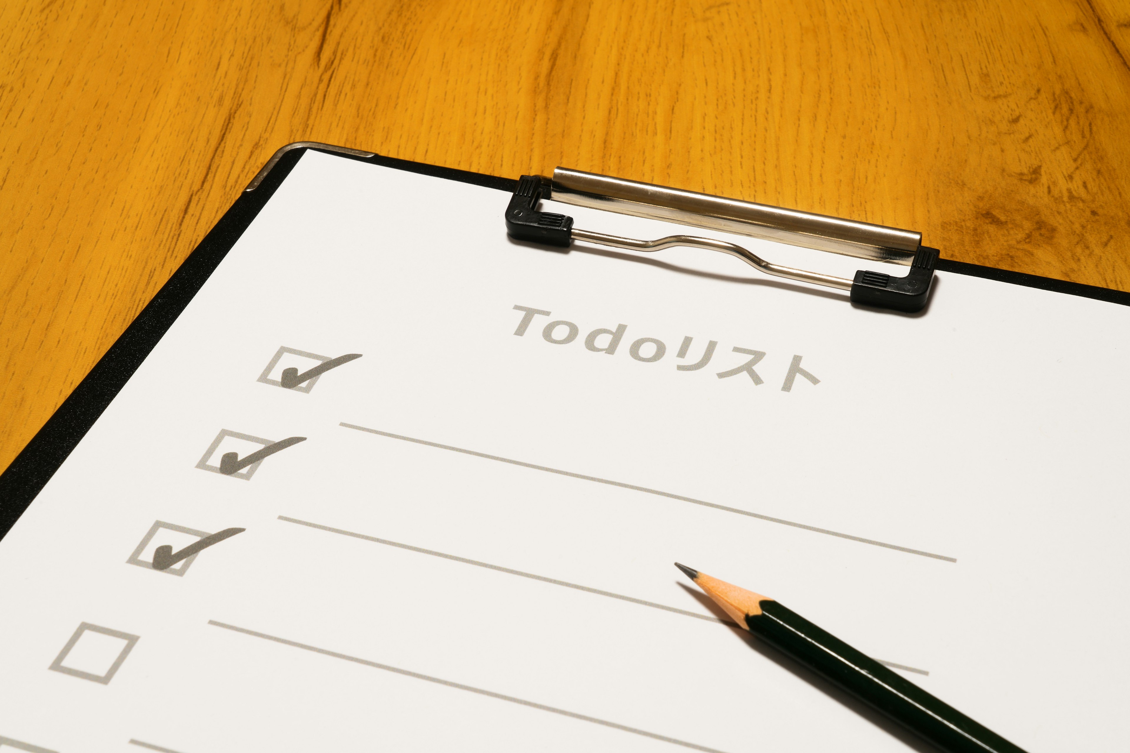 Todo list checklist with pencil on wooden table