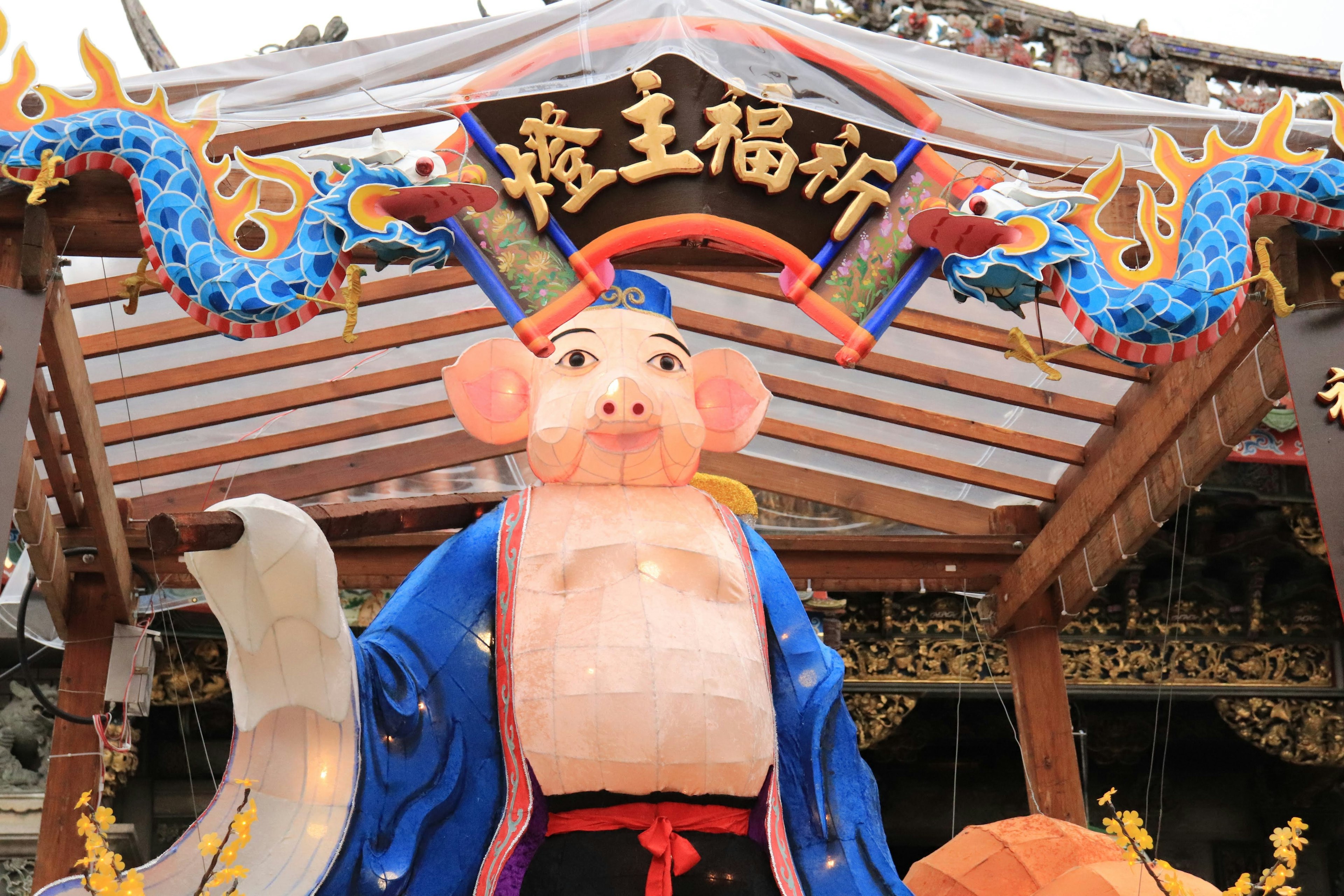 Festival scene featuring a pig deity statue