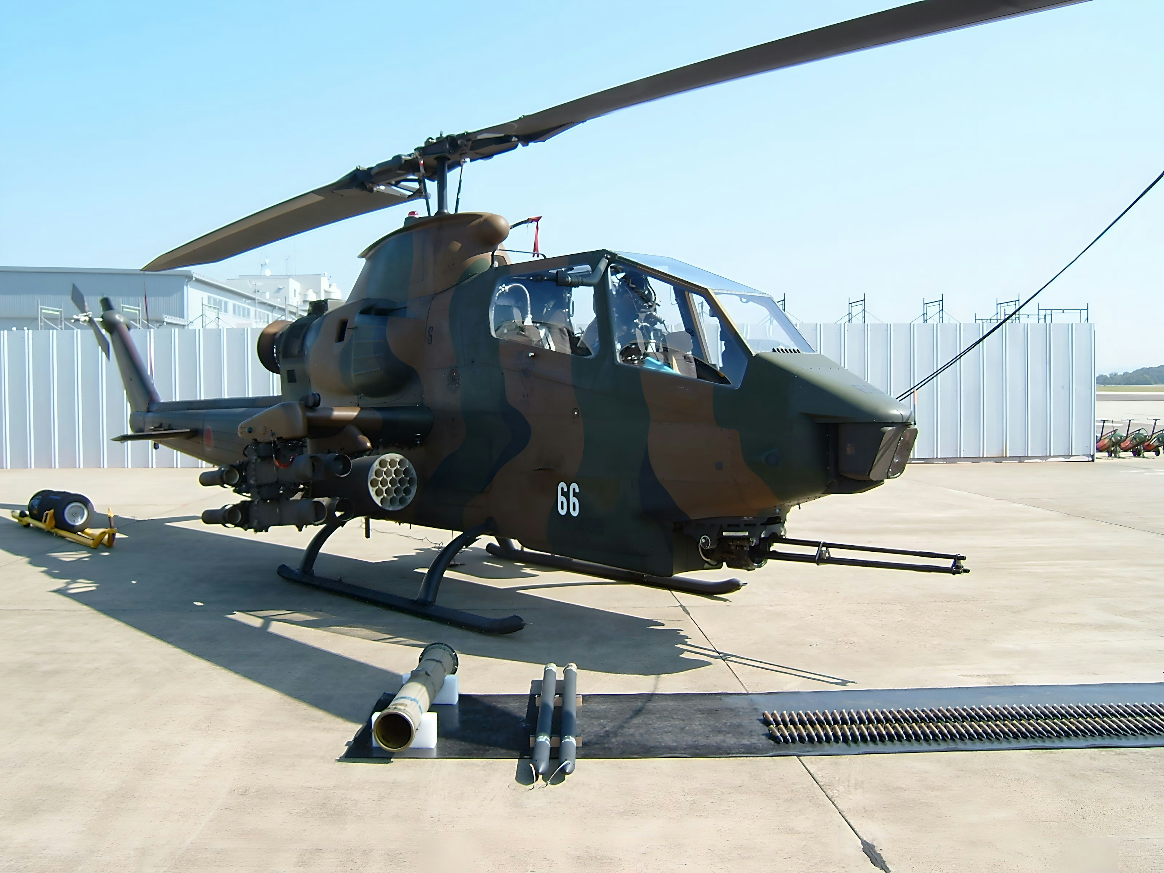 Military helicopter Apache parked on the runway