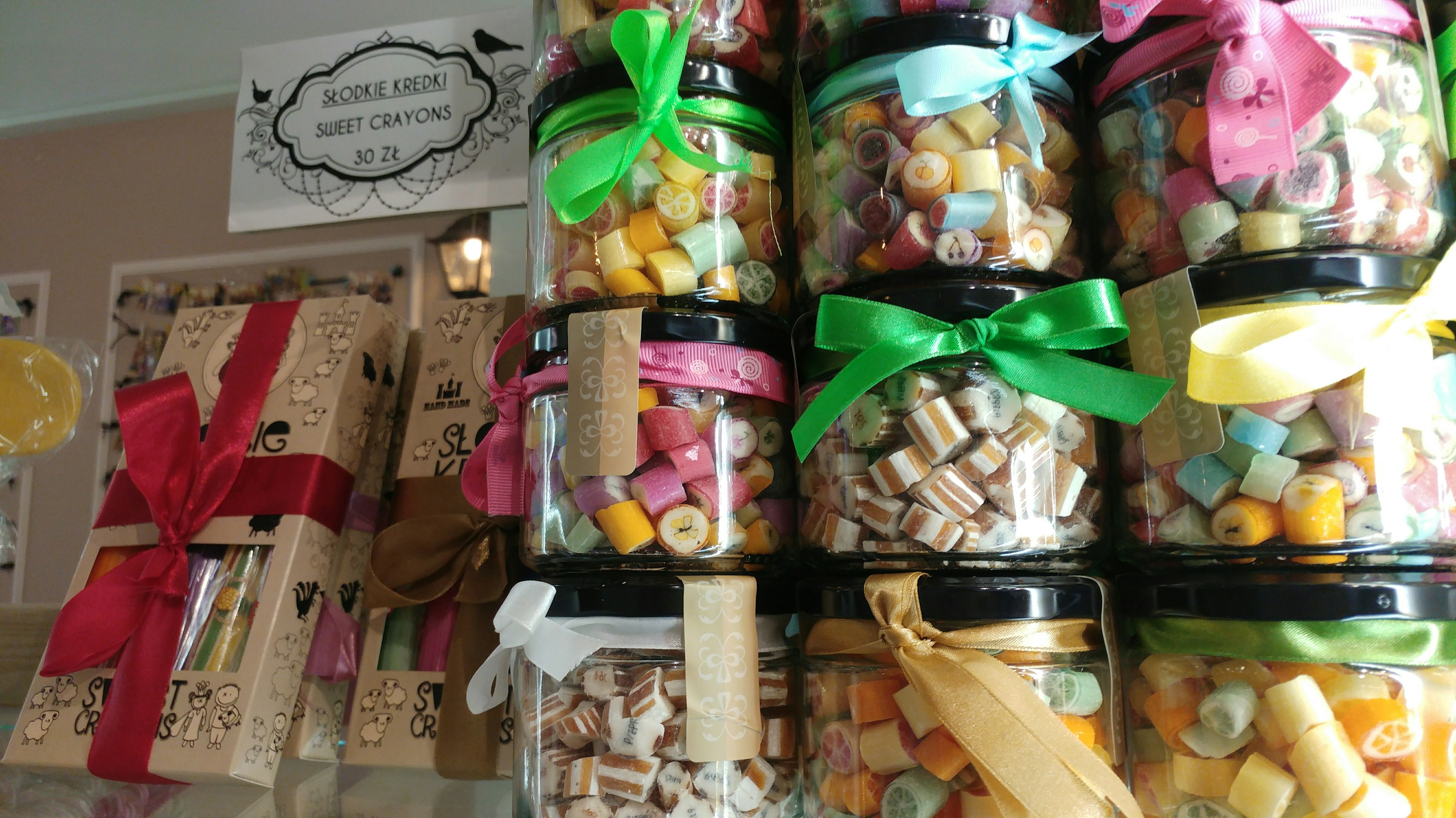 Colorful jars filled with candies stacked in a store