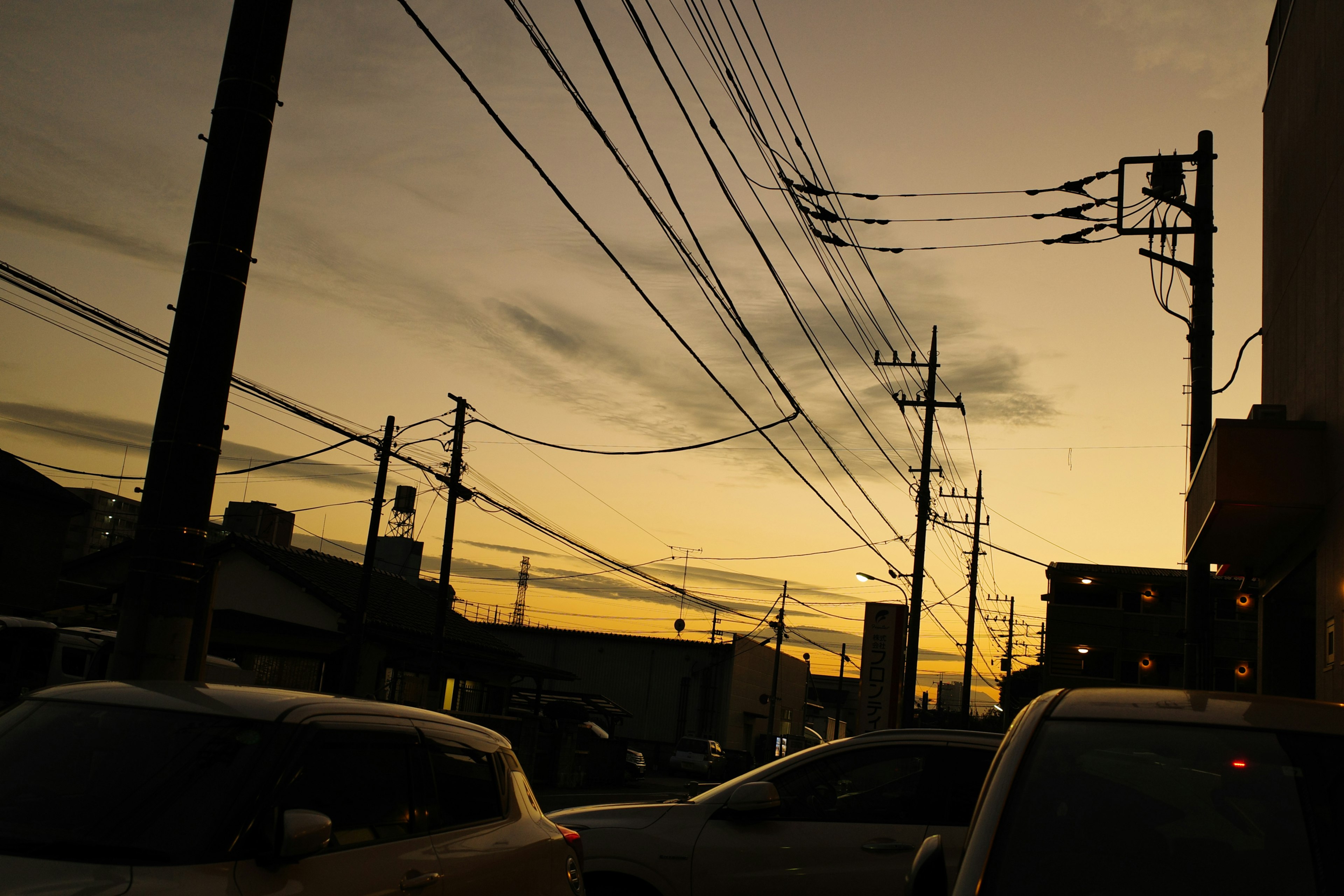 Urban landscape at dusk with visible power lines