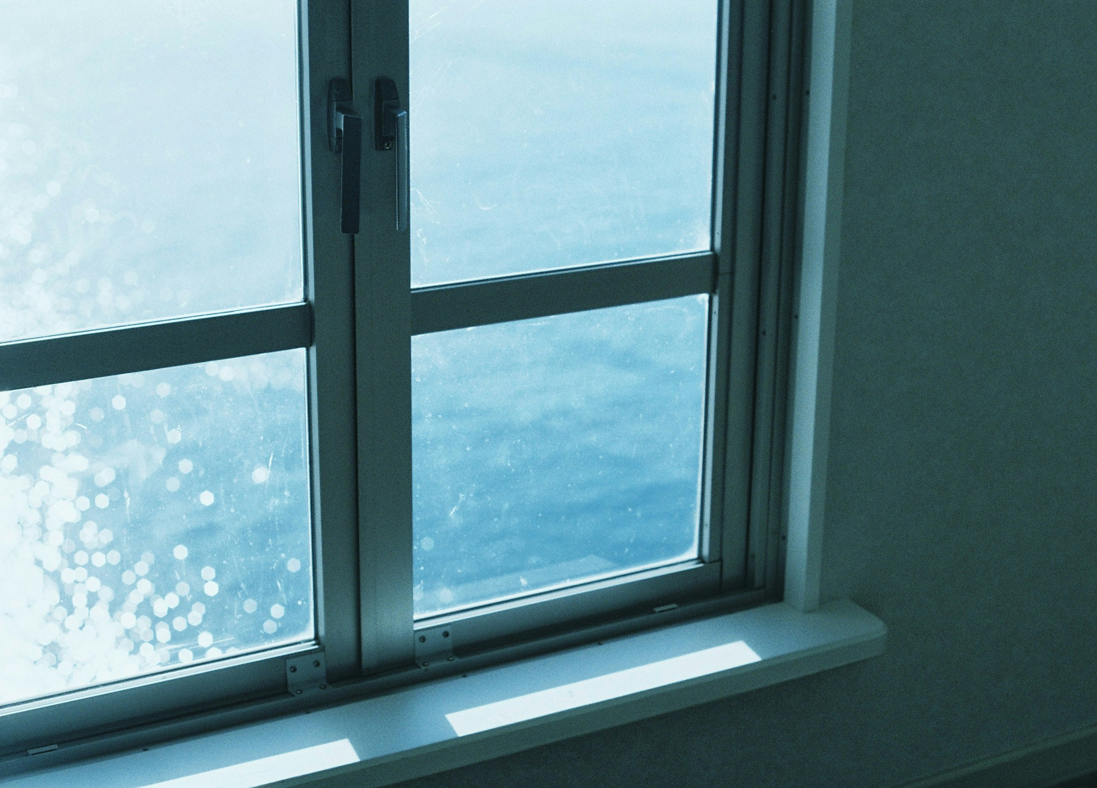 Interior view near a window overlooking the blue sea