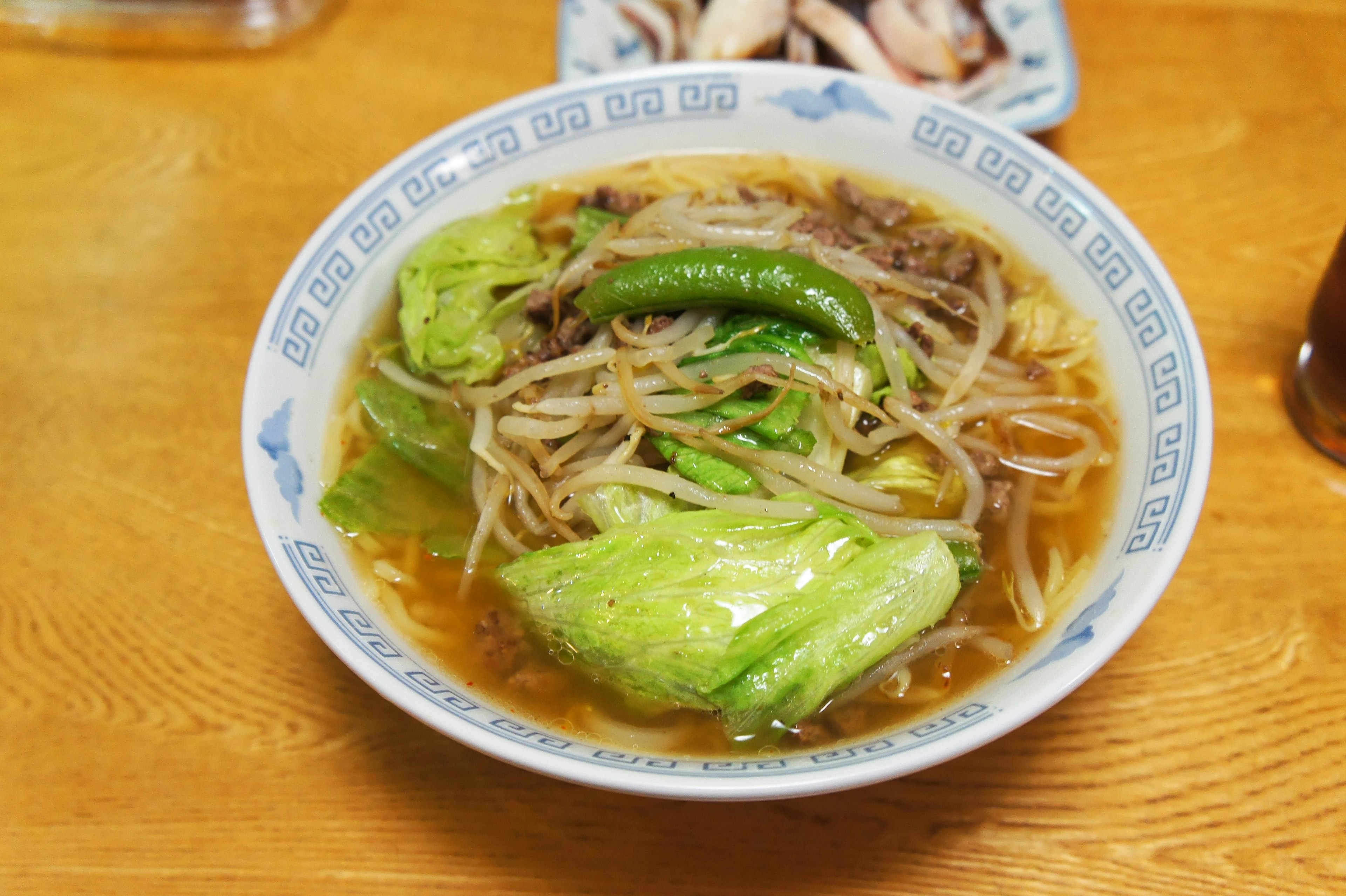 Bowl of ramen with soup and vegetables