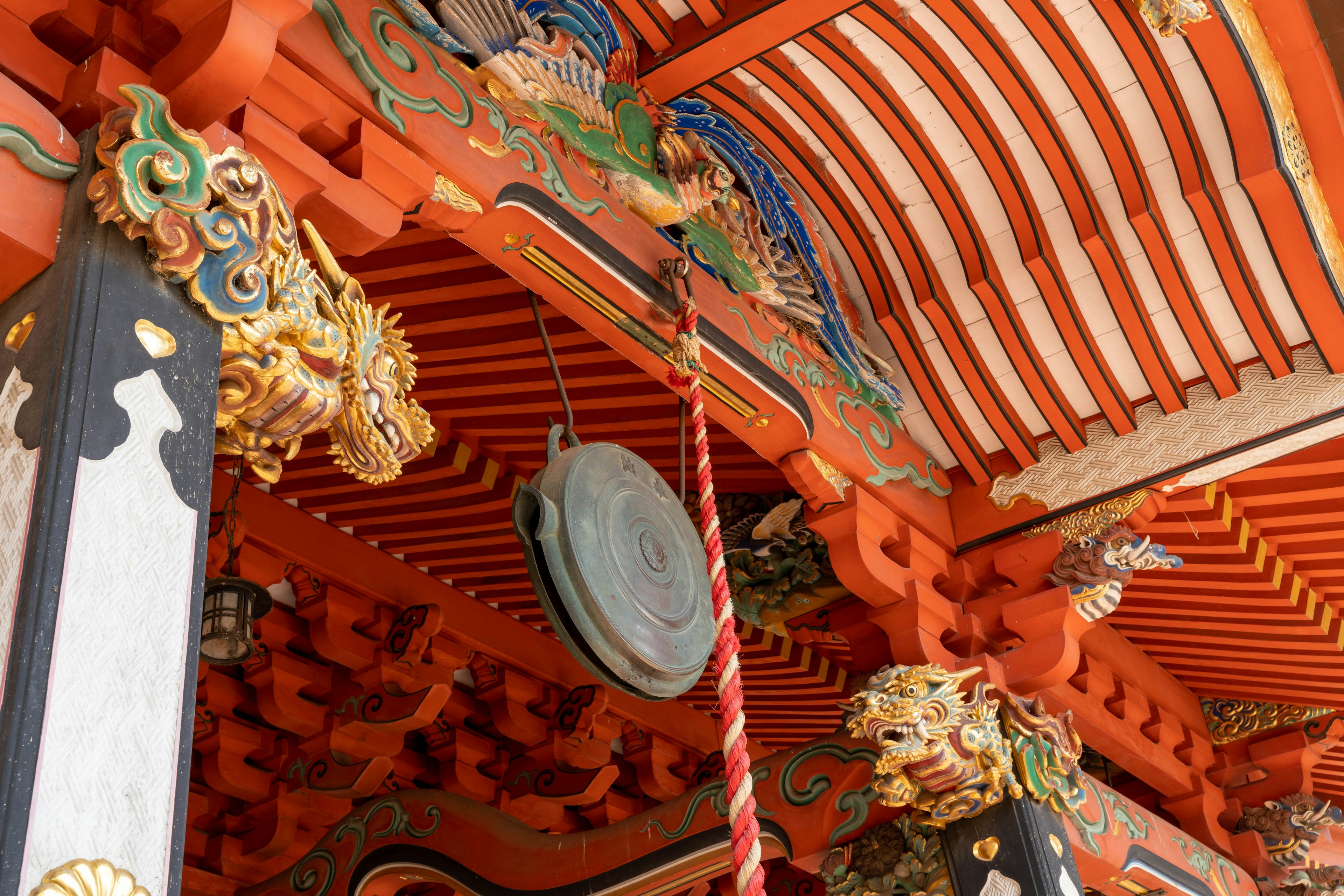 Decoratively crafted roof and bell of a Japanese shrine