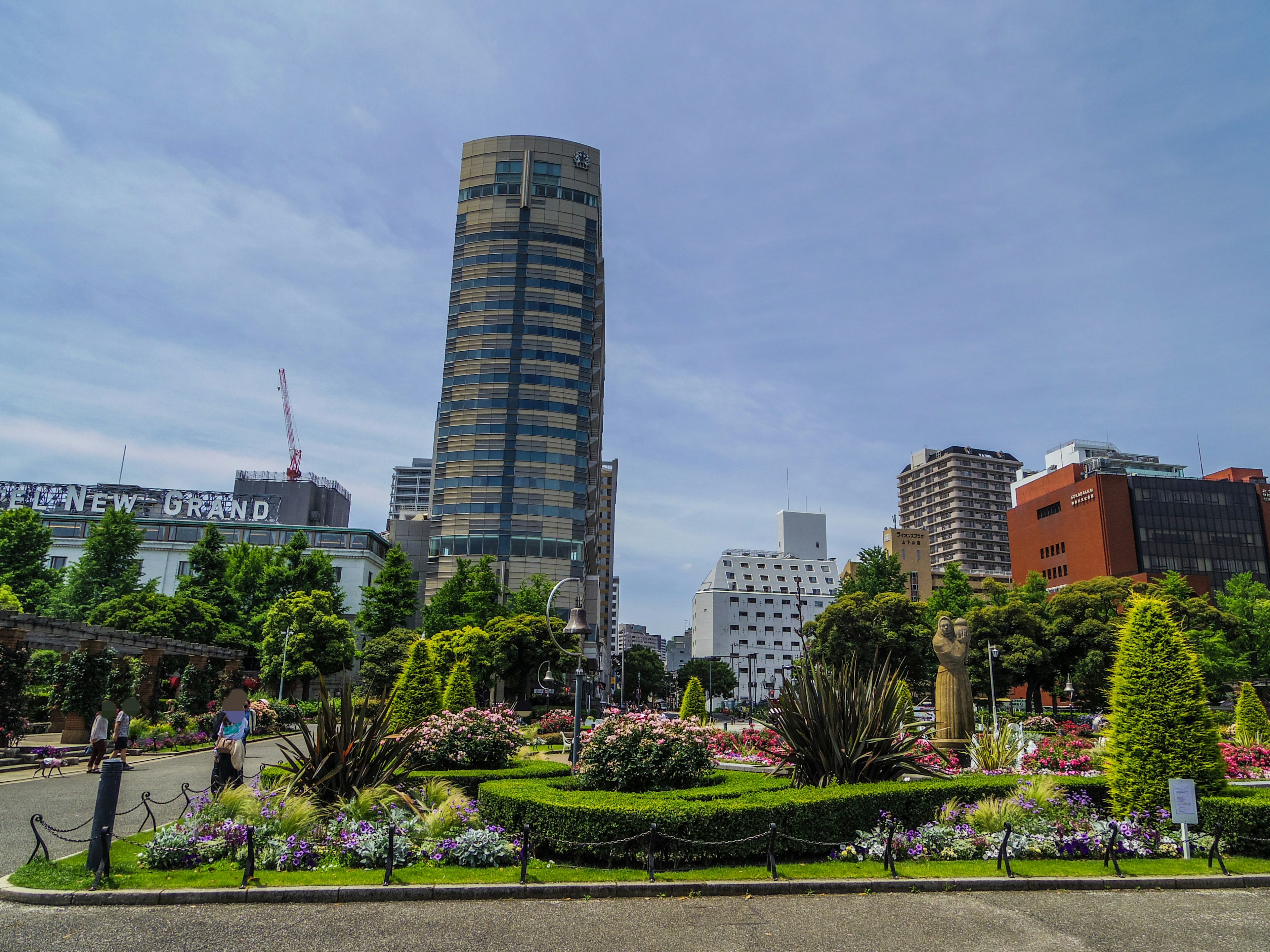 Urban landscape featuring a lush park and skyscrapers