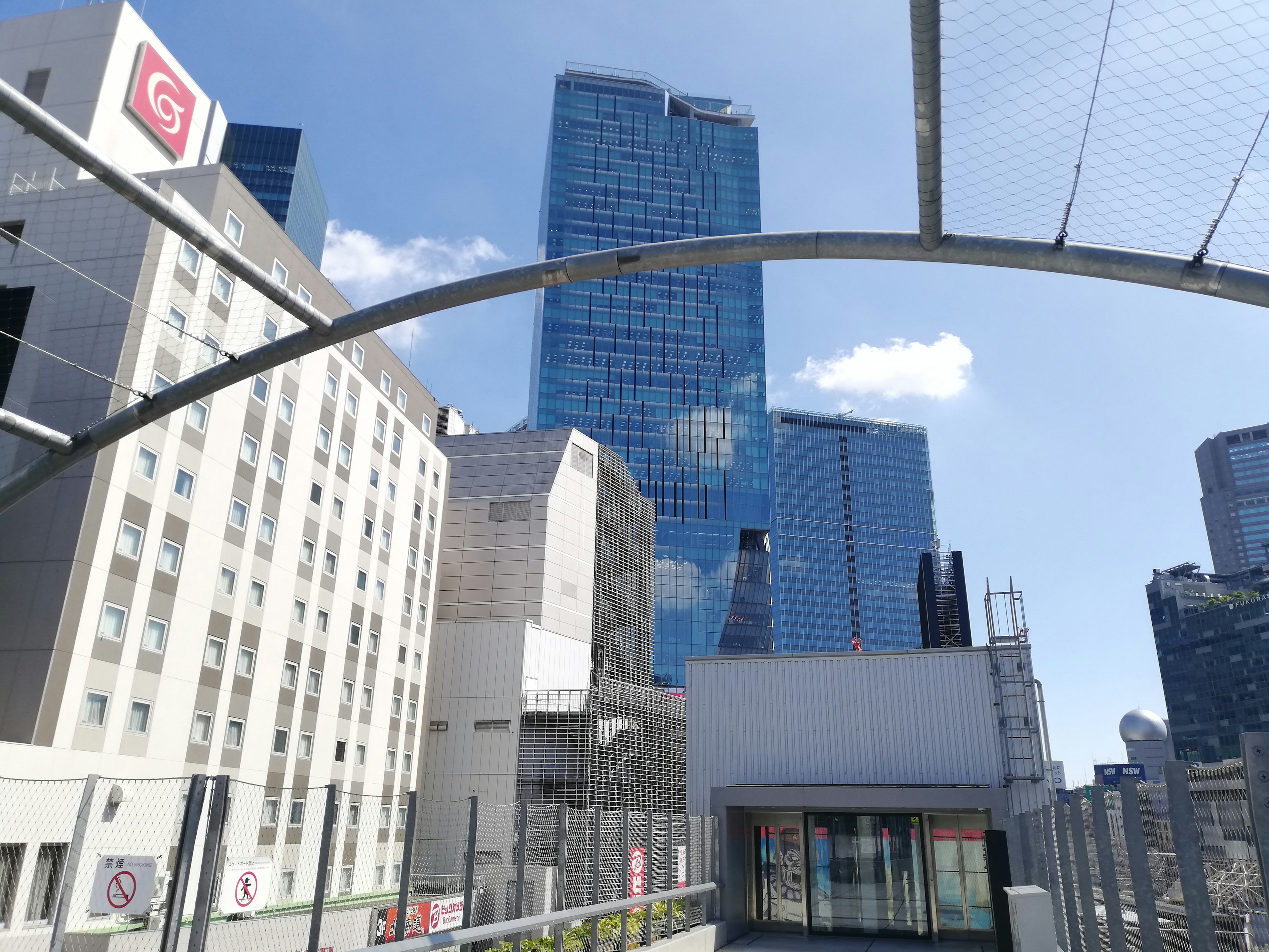 View of skyscrapers under a blue sky in a modern urban landscape