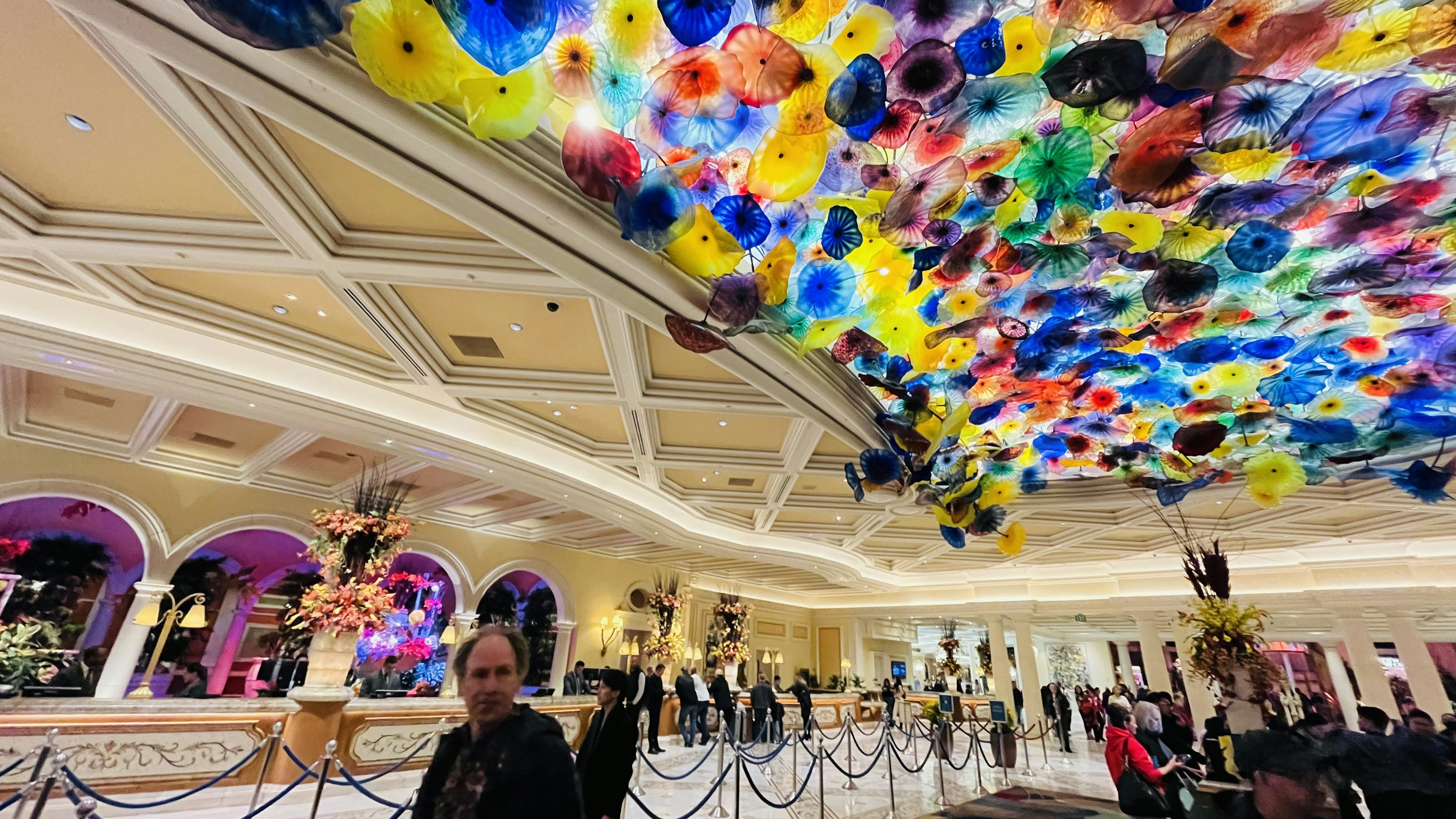 Luxurious lobby featuring a colorful glass art ceiling