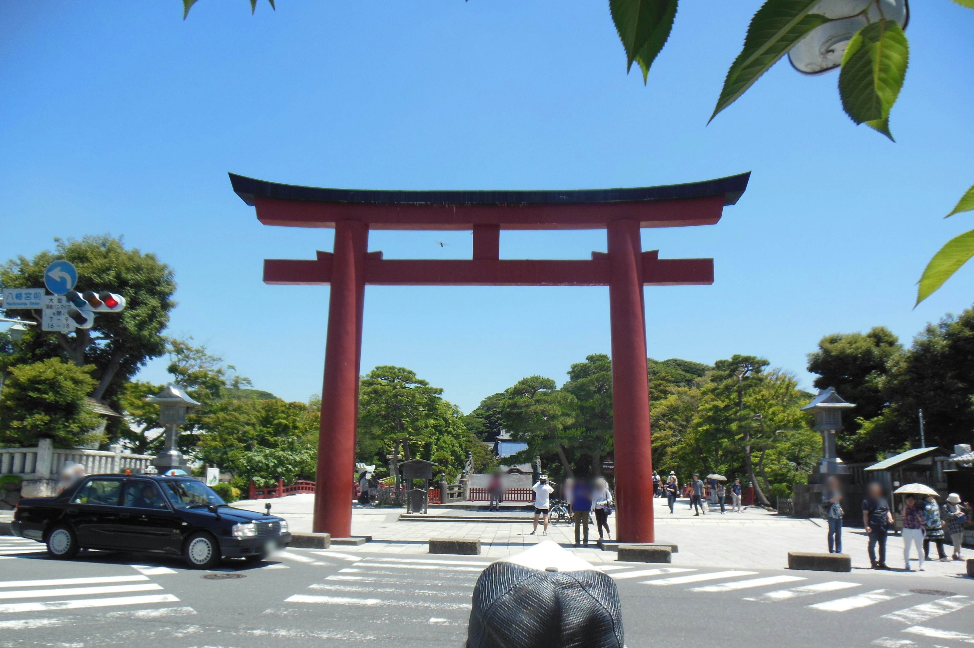 Red torii gate under a clear blue sky