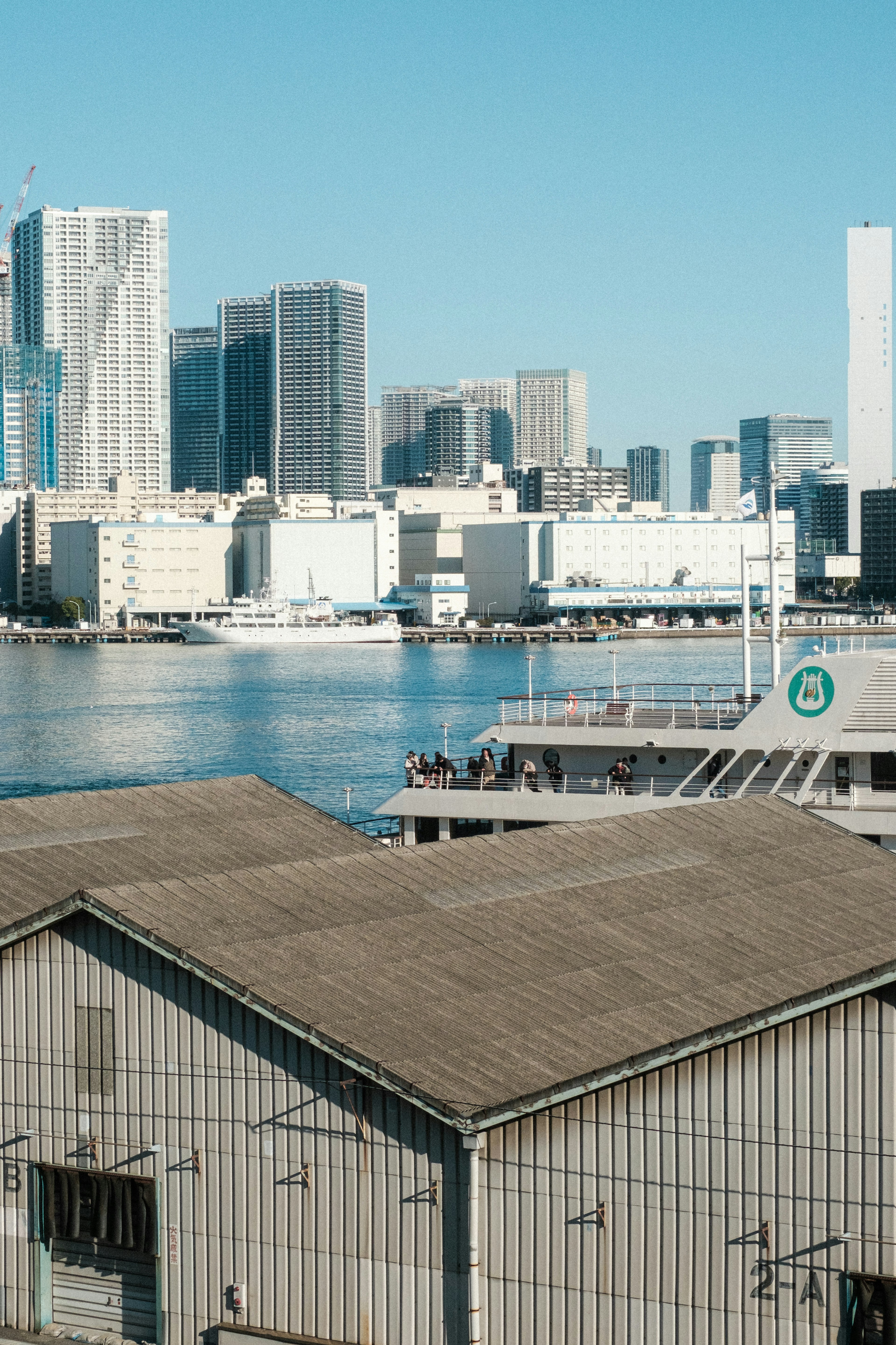 City skyline with buildings and waterfront reflections