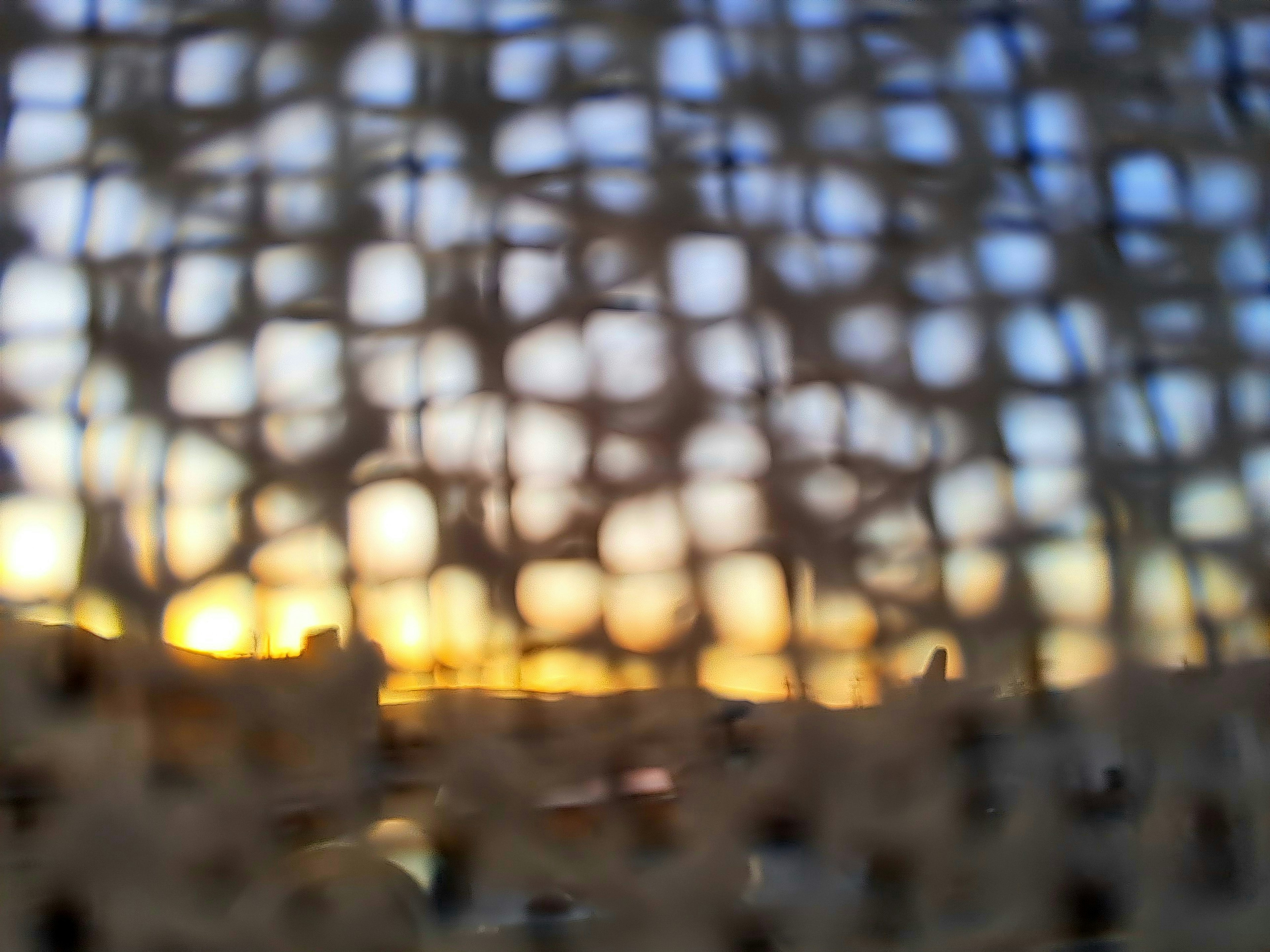 Sunset view through a woven mesh