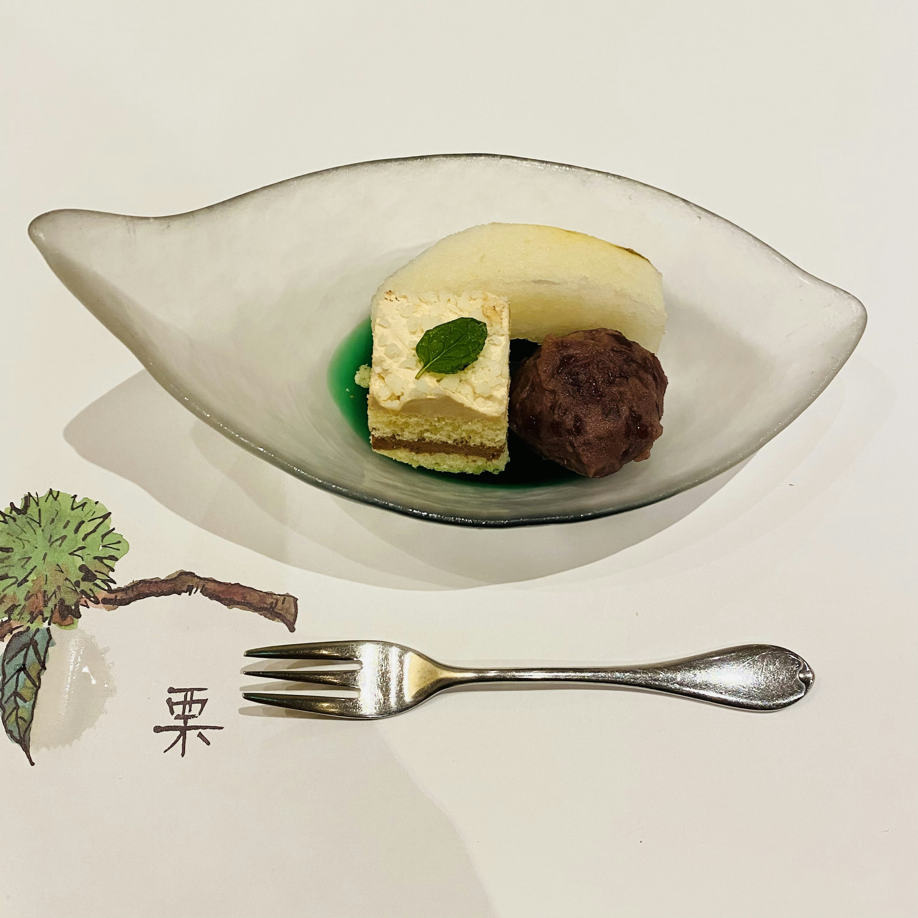 Dessert featuring matcha jelly and vanilla ice cream on a white plate