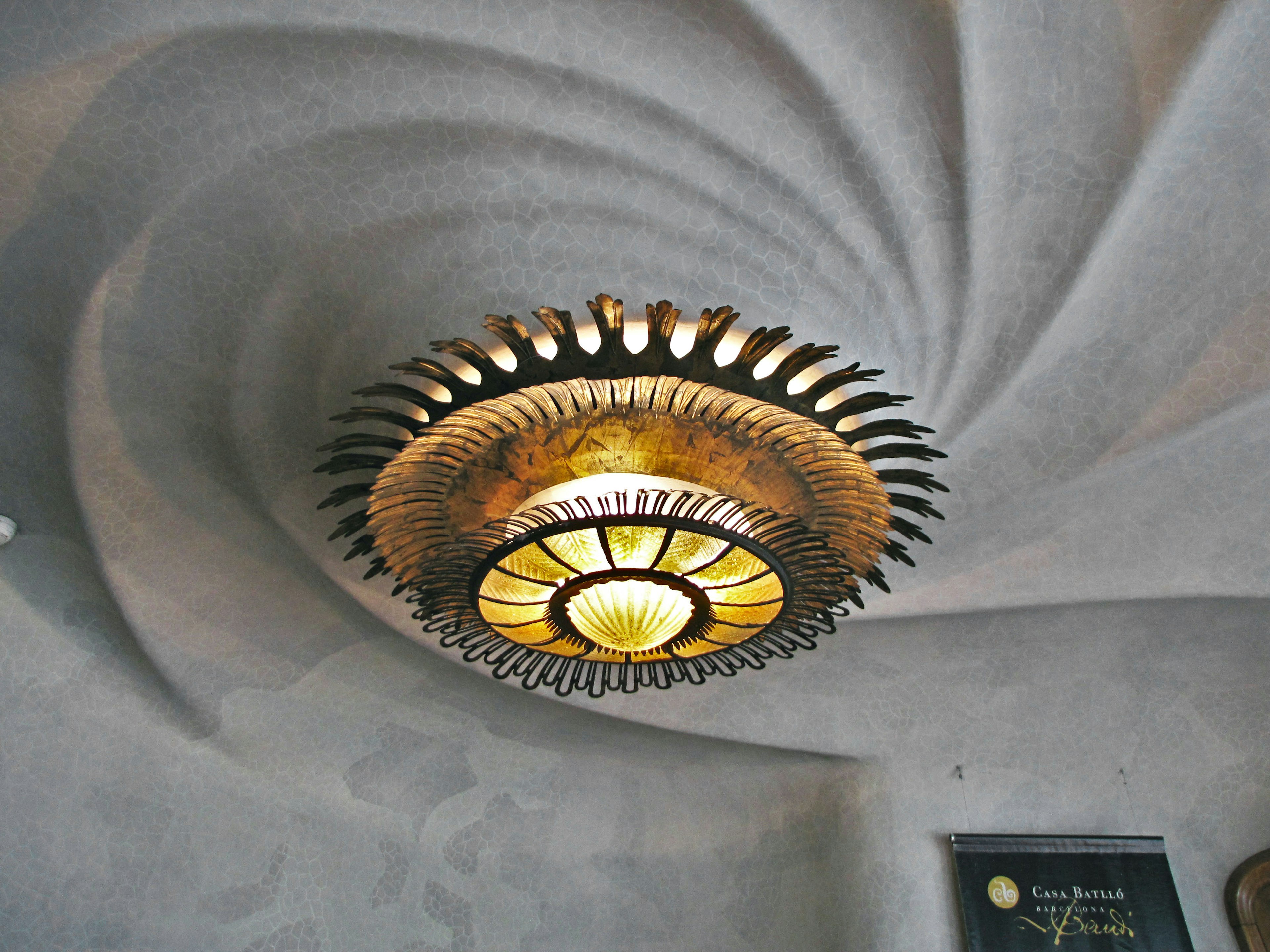 A beautifully designed chandelier mounted on the ceiling