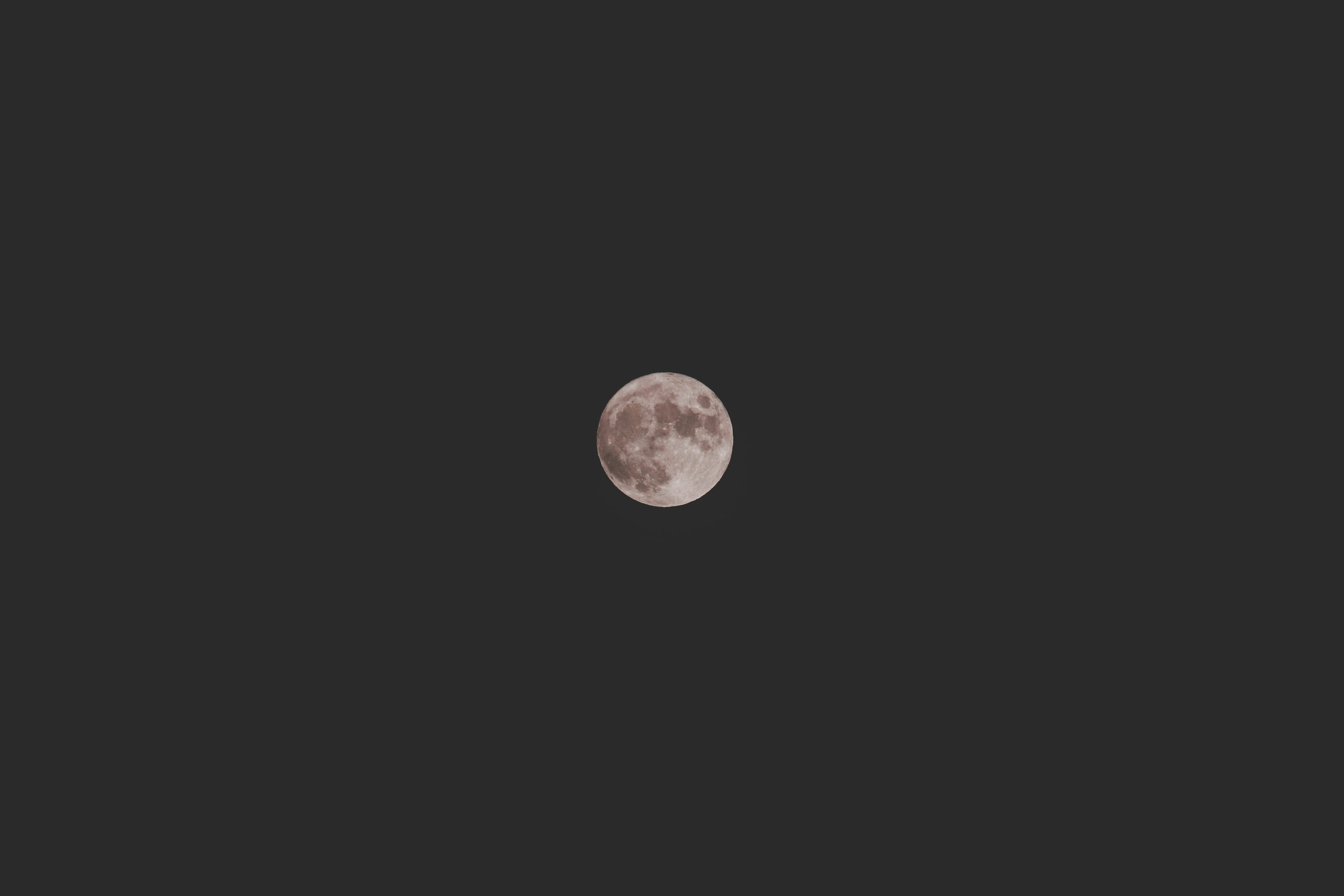 Close-up of a full moon in the night sky