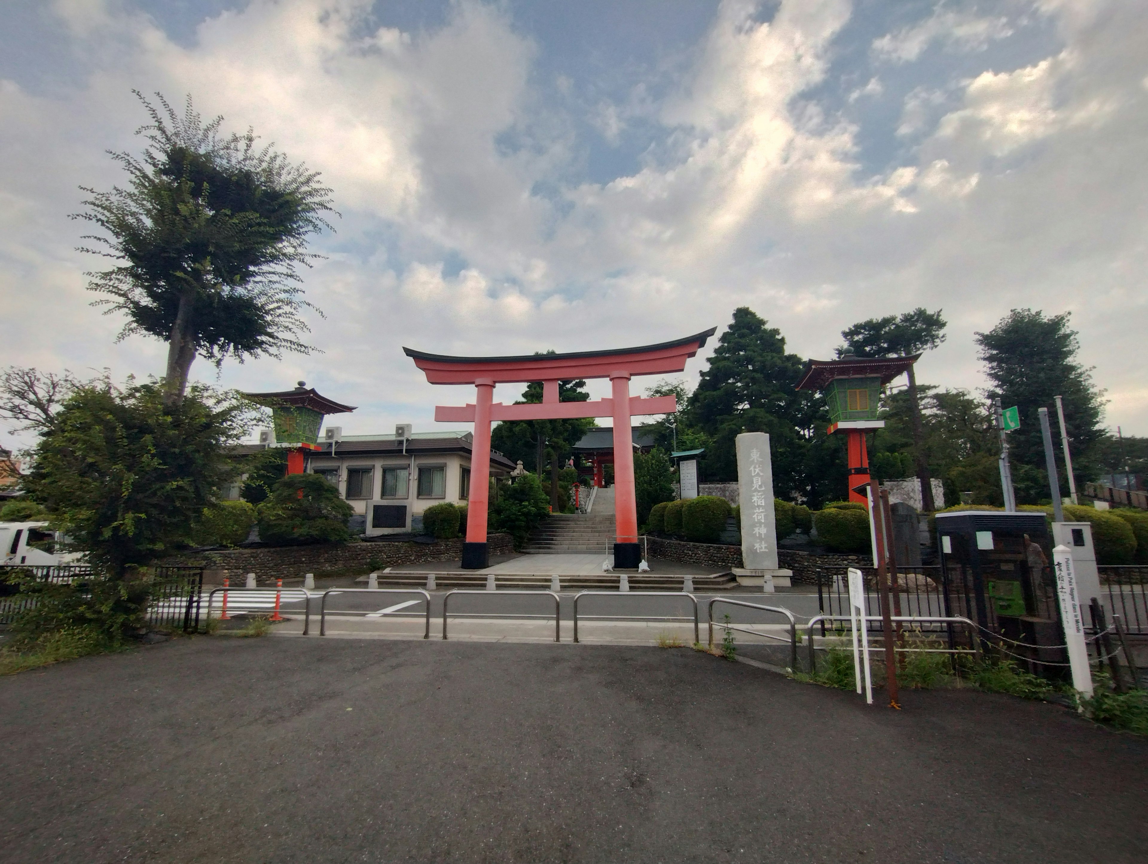 Entrance of a shrine featuring a red torii gate