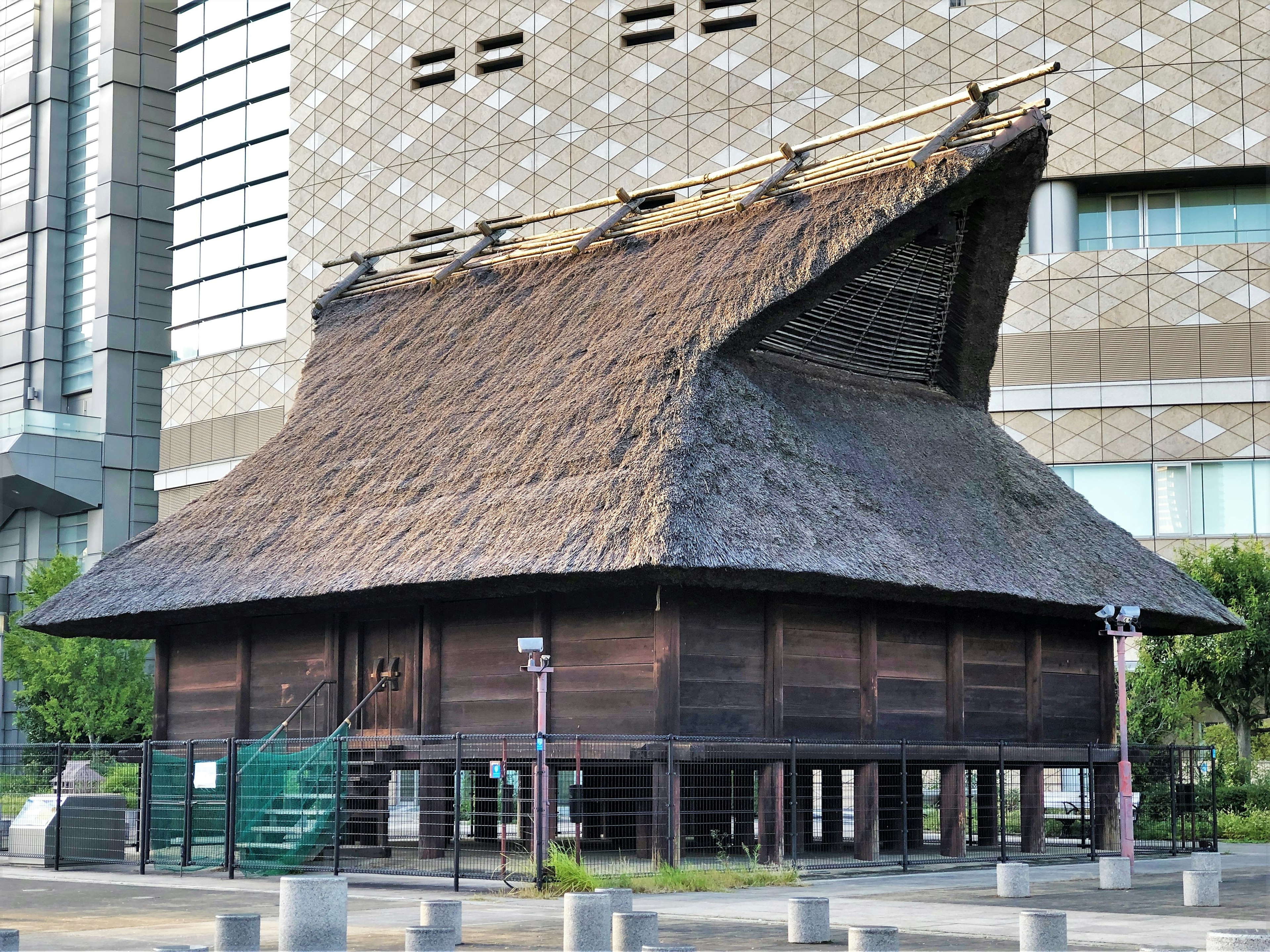 Traditional Japanese building with a thatched roof