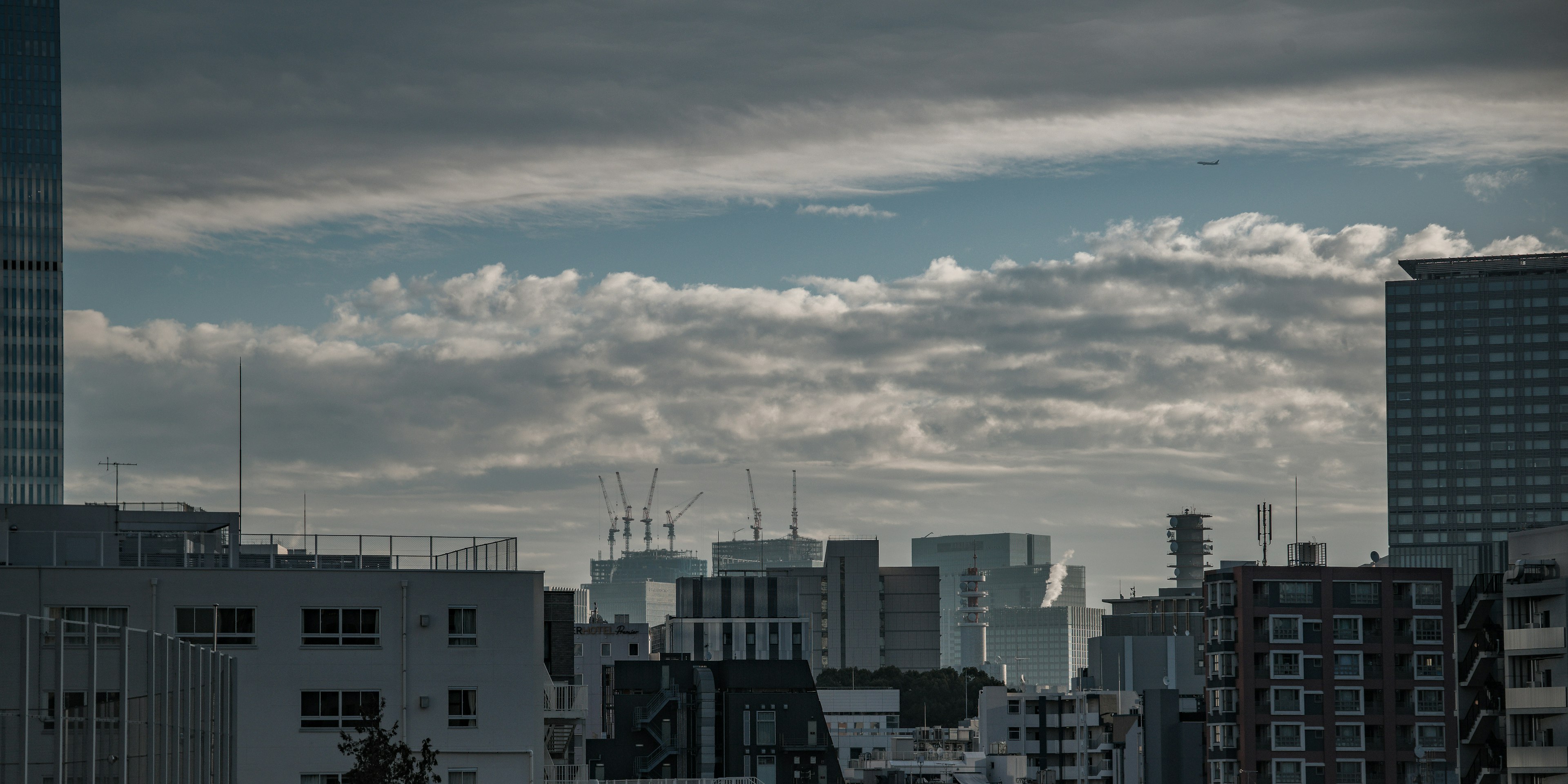 City skyline with buildings and cloudy sky