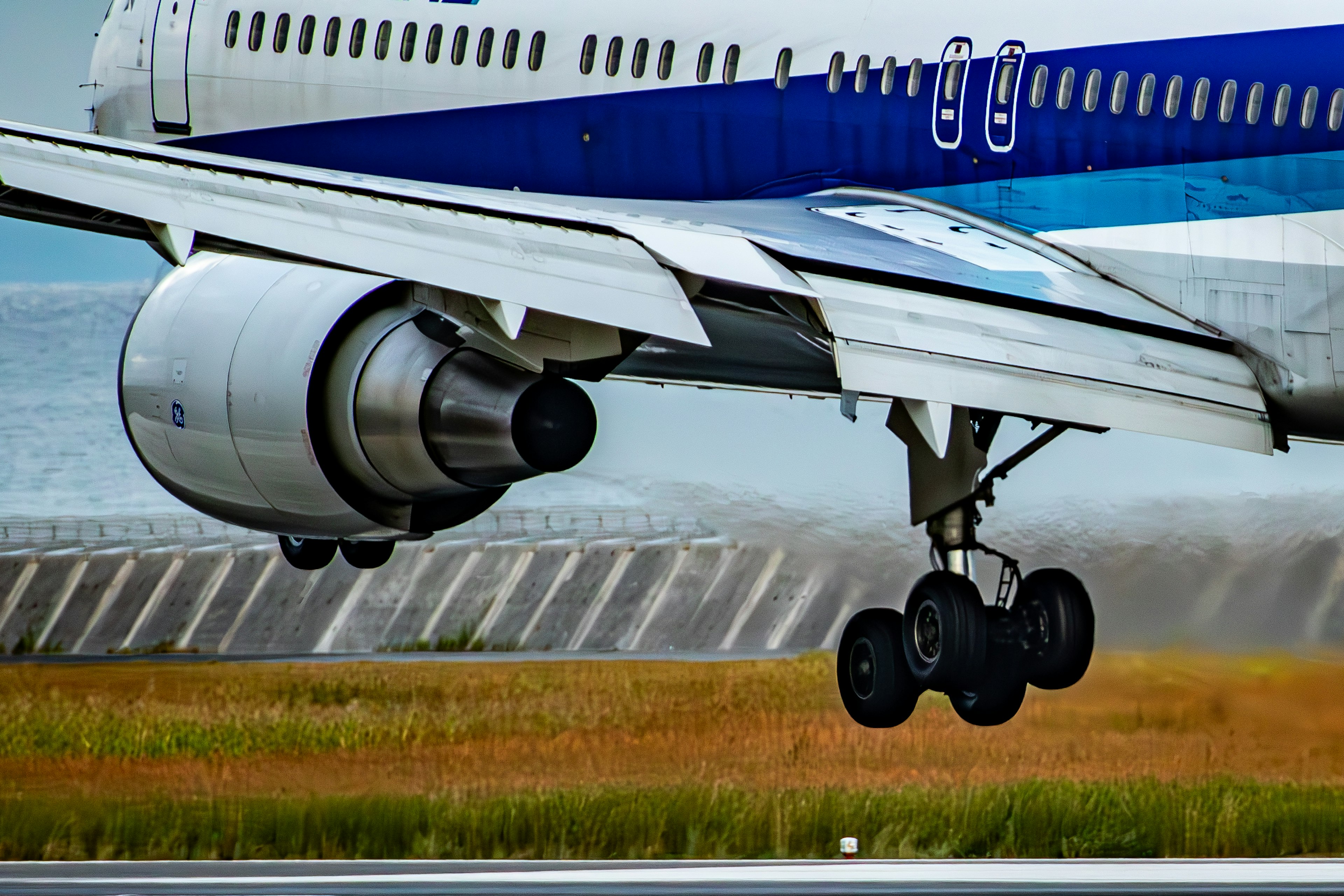 Close-up of an airplane engine and landing gear