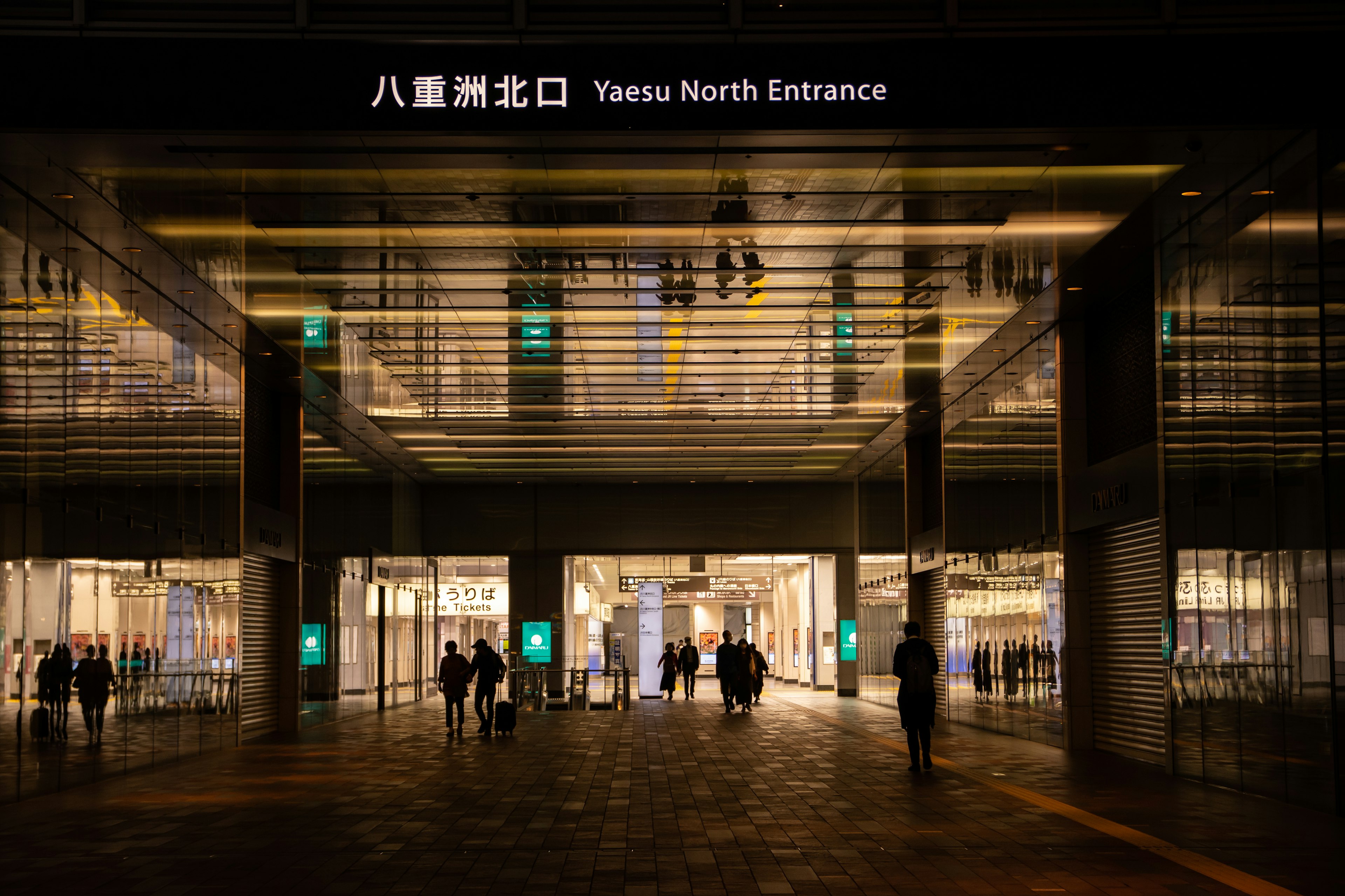 Night view of Yaesu North Entrance with people walking