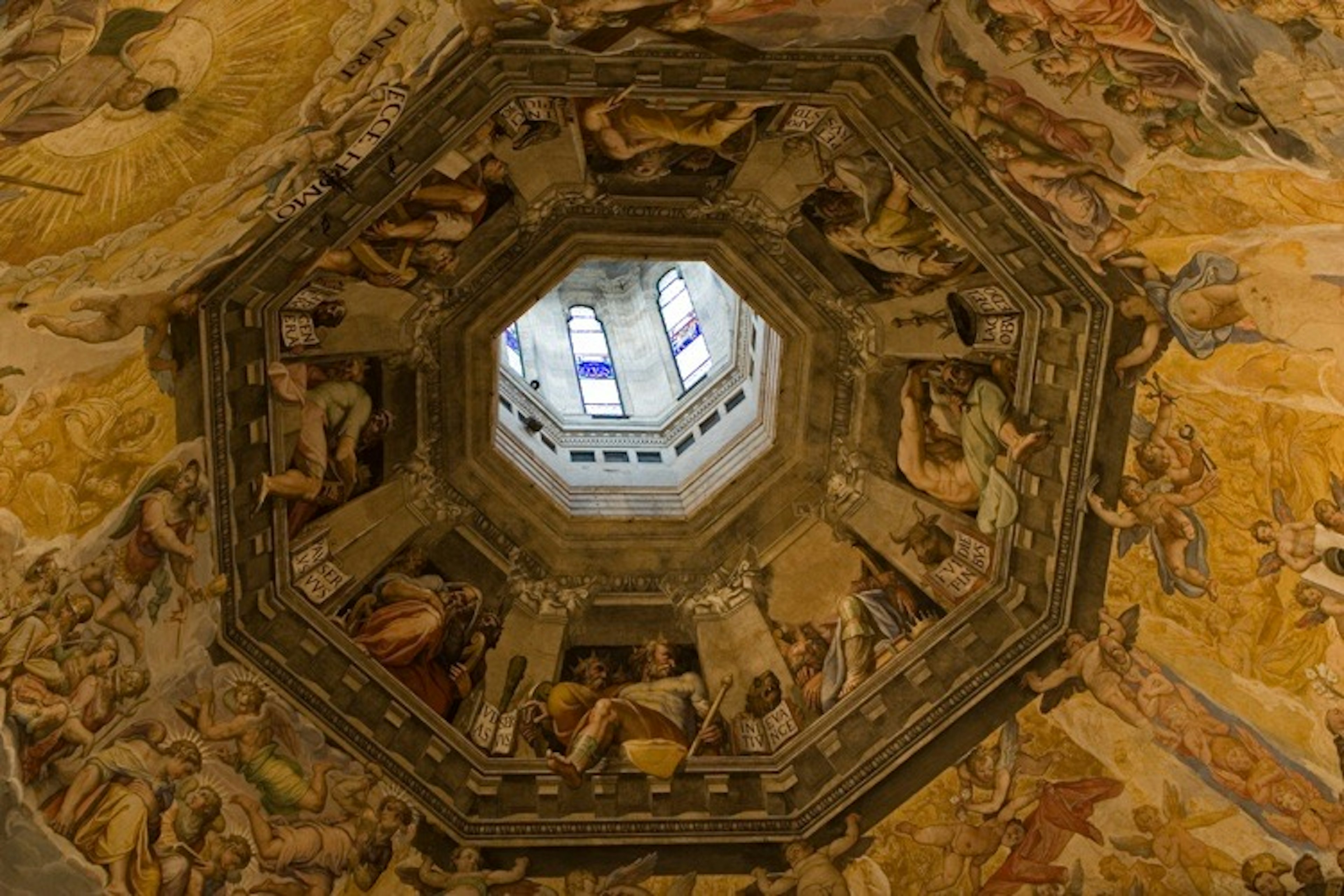 View looking up at the ceiling of the Florence dome showcasing vibrant frescoes in an octagonal structure