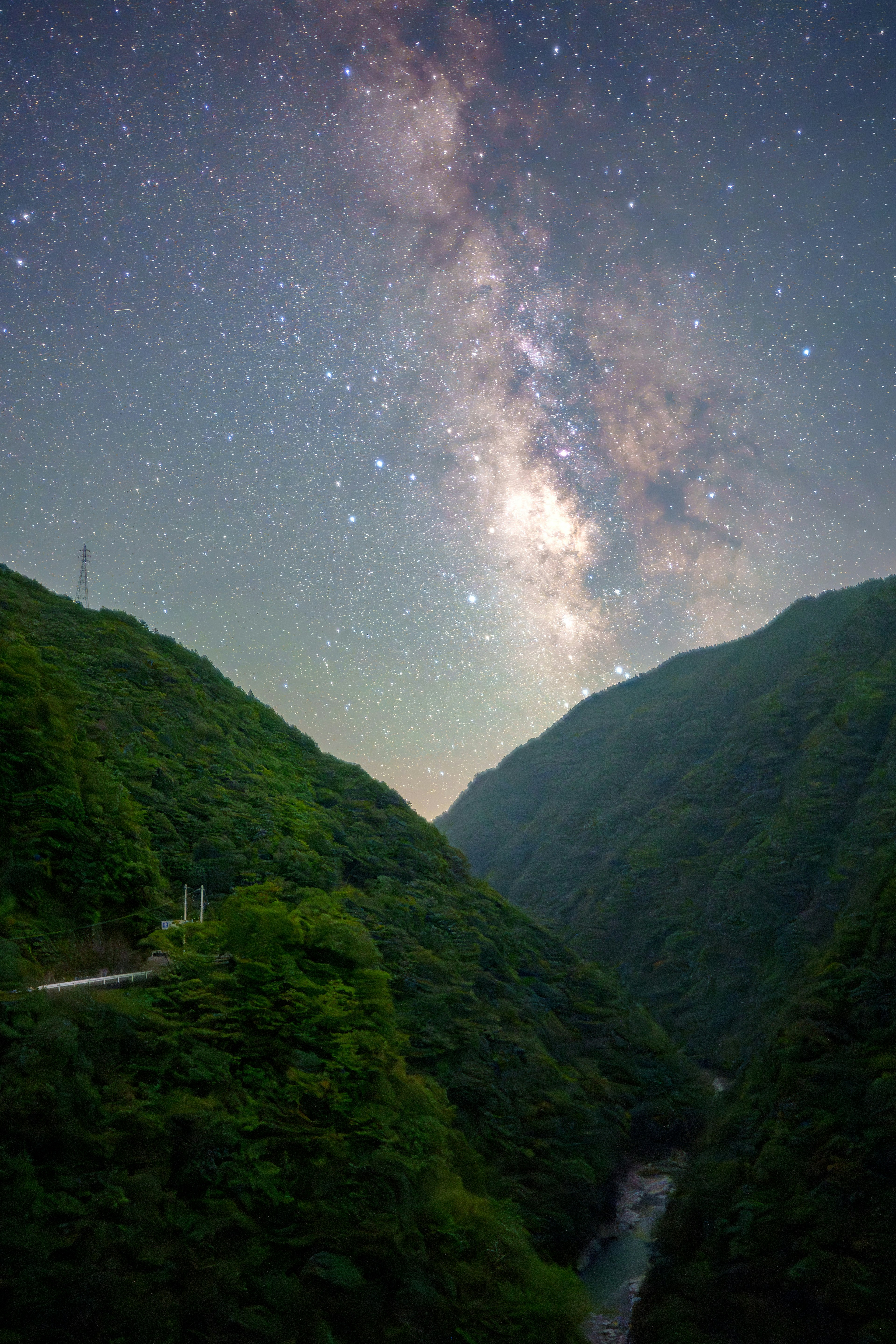 Scenic mountain valley with a starry sky