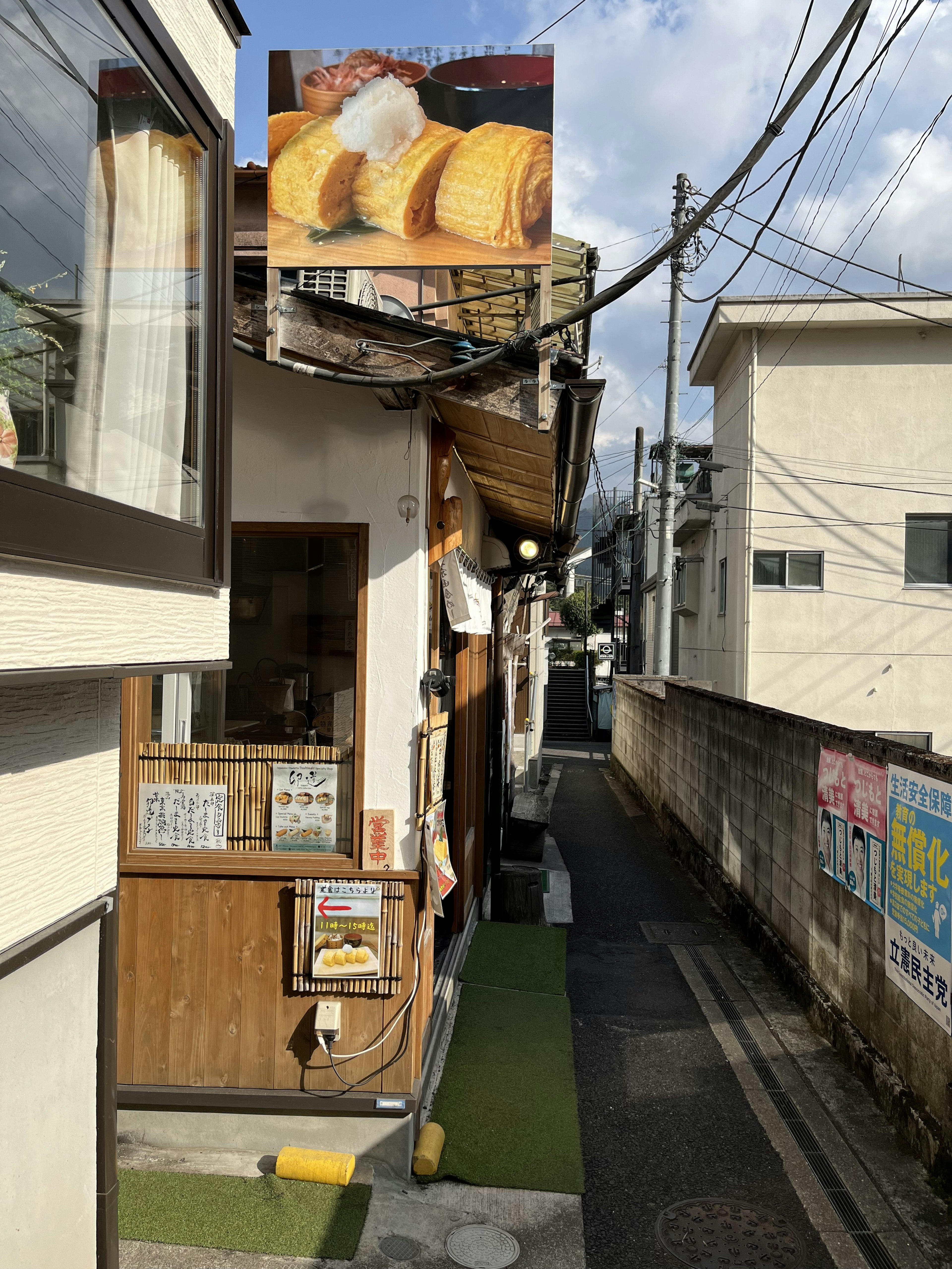 Narrow alley with a bakery exterior and sign